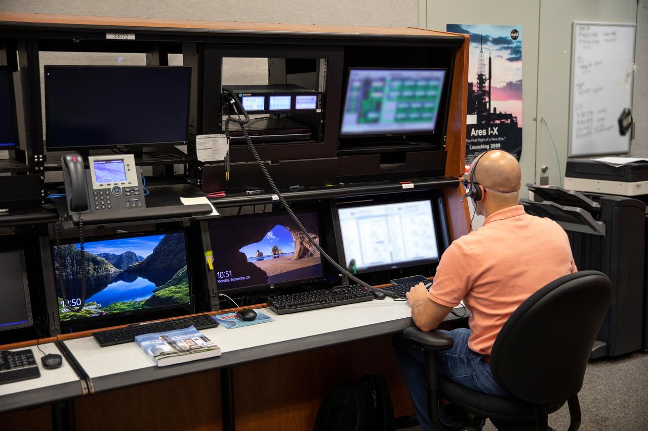 Inside the Launch Control Center at Kennedy Space Center on Sept. 29, 2020, engineer Danny Zaatari, with Exploration Ground Systems, works on software for the launch of Artemis I. Engineers at the Florida spaceport are staying focused on the “Path to the Pad.” Artemis I is the first in a series of increasingly complex missions that will enable human exploration to the Moon and Mars.