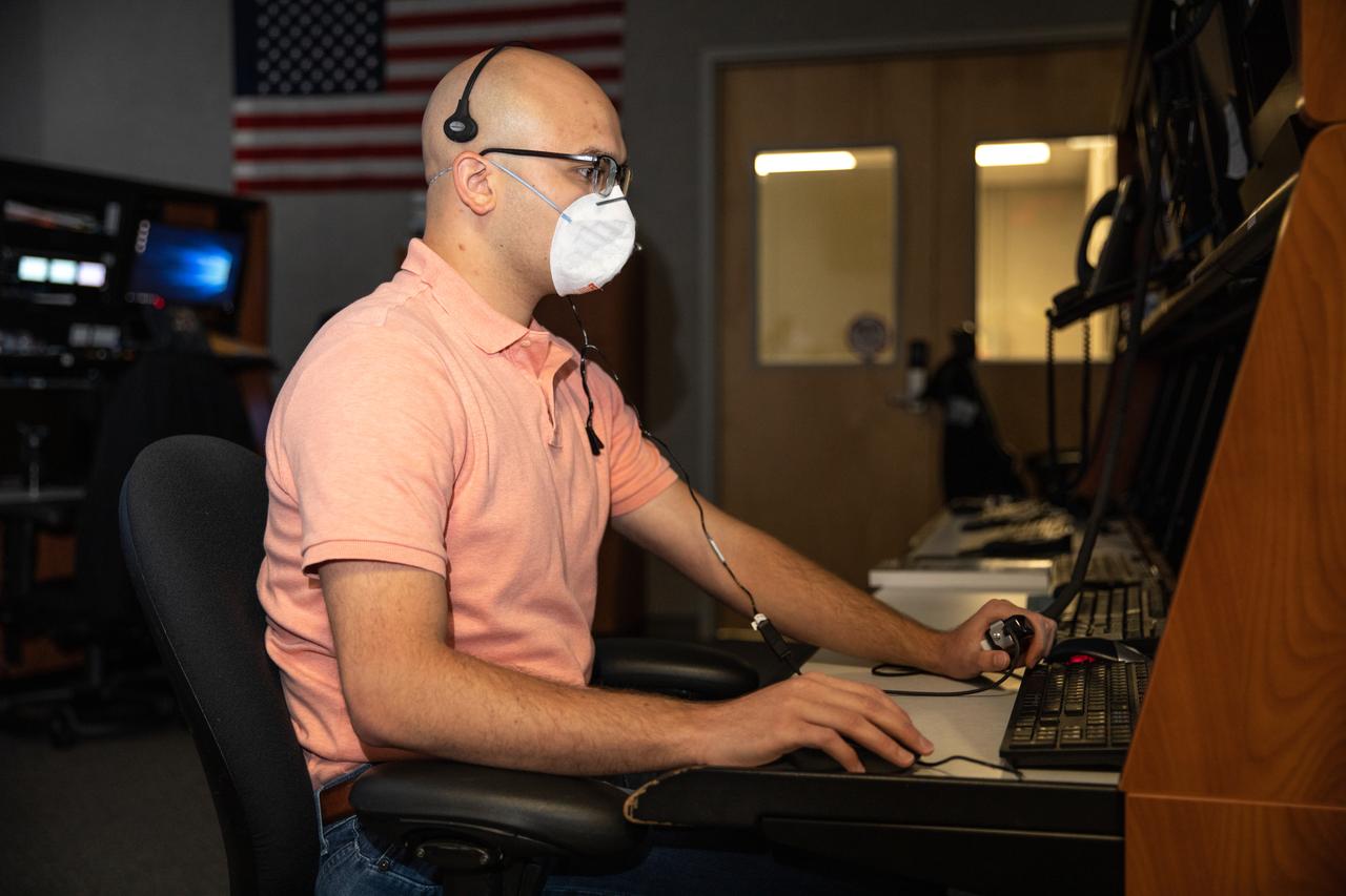 Inside the Launch Control Center at Kennedy Space Center on Sept. 29, 2020, engineer Danny Zaatari, with Exploration Ground Systems, works on software for the launch of Artemis I. Engineers at the Florida spaceport are staying focused on the “Path to the Pad.” Artemis I is the first in a series of increasingly complex missions that will enable human exploration to the Moon and Mars.