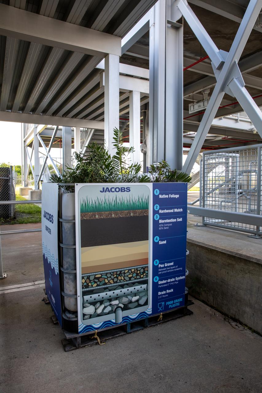 NASA Kennedy Space Center’s unrivaled dedication to the environment is highlighted through a variety of environmental programs and projects. Through a partnership with Jacobs Technology, Inc., teams have constructed a bio-filter – made of layered rock, soil, and native plants – as an eco-friendly way to filter zinc out of rainwater runoff. Photographed on Sept. 29, 2020, at the Florida spaceport’s Launch Complex 39 observation tower, the bio-filter catches water that runs off of this location’s galvanized roof, which contains a coating of zinc to help protect the metal from rust or corrosion. The plants in the bio-filter bind to the zinc so that when the water comes out of the bottom, it’s clean and safe to go into the Indian River Lagoon – its waterline located about 20 to 30 feet away.