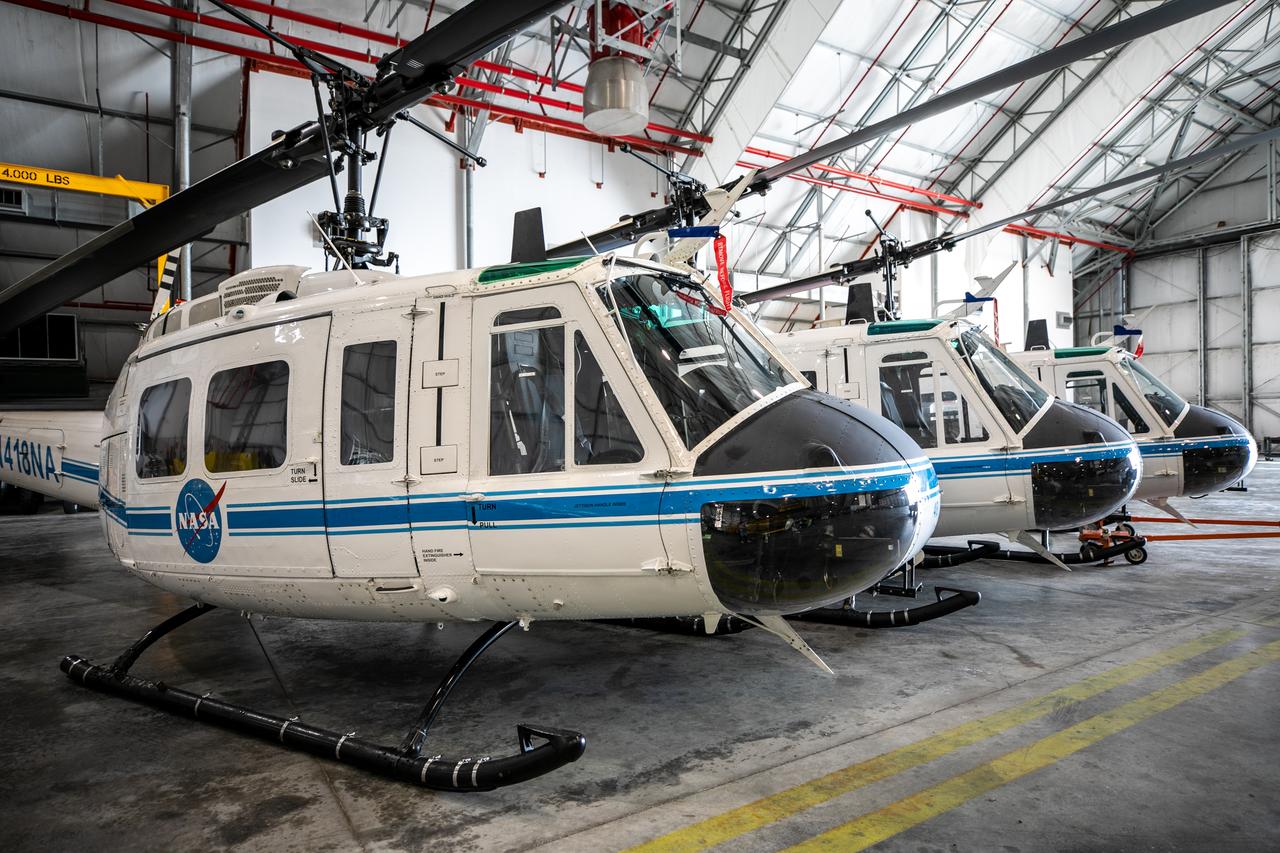 The three Bell Huey 2 helicopters utilized by Kennedy Space Center’s Flight Operations team for security purposes are photographed inside the Launch and Landing Facility hangar on Sept. 30, 2020. Two new Airbus H135 (T3) helicopters arrived at the Florida spaceport on Sept. 30 to replace the Bell Huey 2 aircraft in service now. The new helicopters provide a number of technological and safety advantages over the Hueys, such as more lifting power, greater stability in the air, and expanded medical capabilities. The team expects to fully transition to flying the two H135 aircraft later this year. A third is expected to arrive in early 2021, and with its arrival, will complete the fleet’s upgrade.