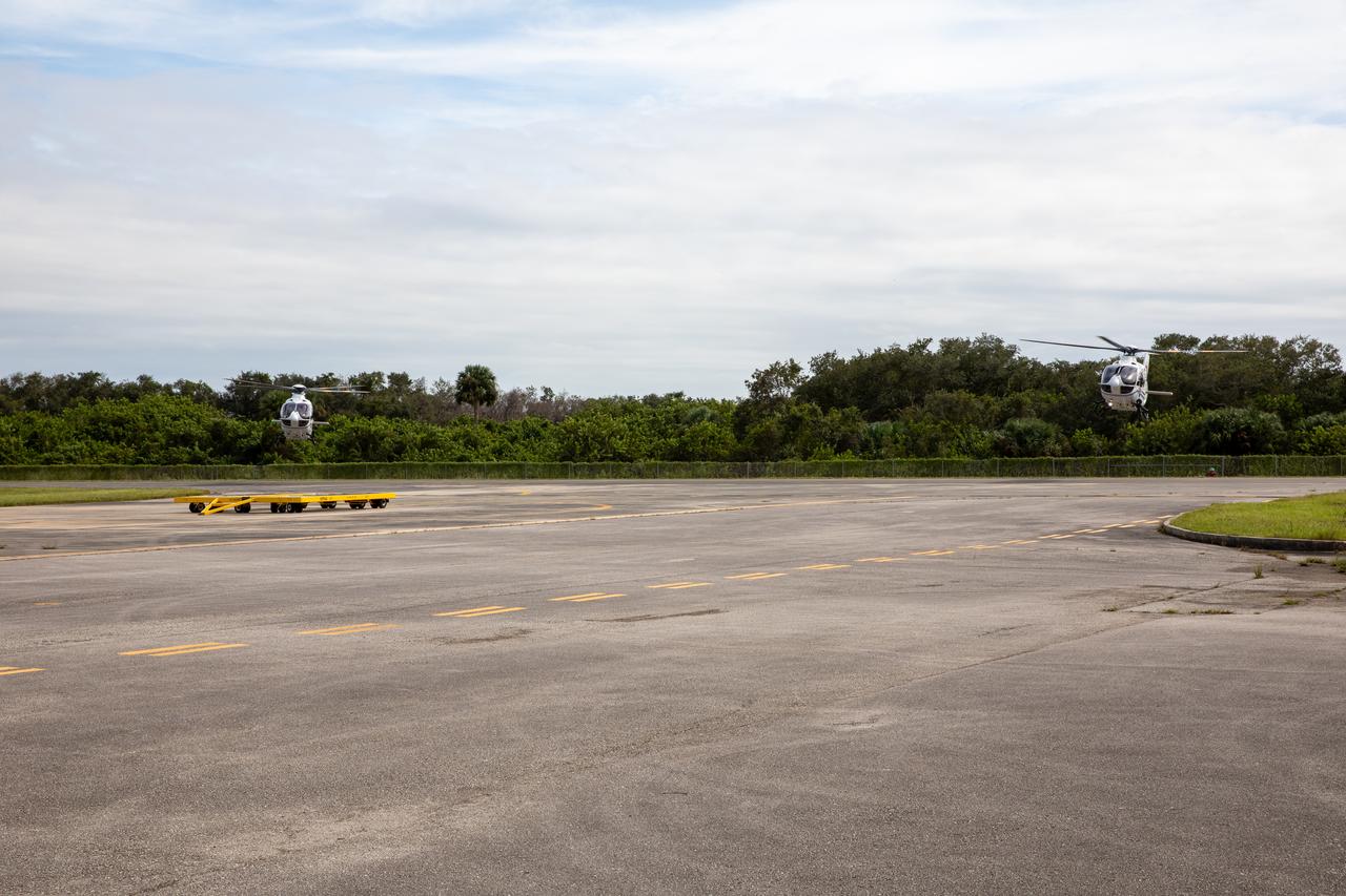 Two new Airbus H135 (T3) helicopters arrive at the Launch and Landing Facility runway at NASA’s Kennedy Space Center in Florida on Sept. 30, 2020. The H135 helicopters will replace the Bell Huey 2 security aircraft in service now, maintained by Kennedy’s Flight Operations team. These new helicopters provide a number of technological and safety advantages over the Hueys, such as more lifting power, greater stability in the air, and expanded medical capabilities. The team expects to fully transition to flying the two H135s later this year. A third is expected to arrive in early 2021, and with its arrival, will complete the fleet’s upgrade.