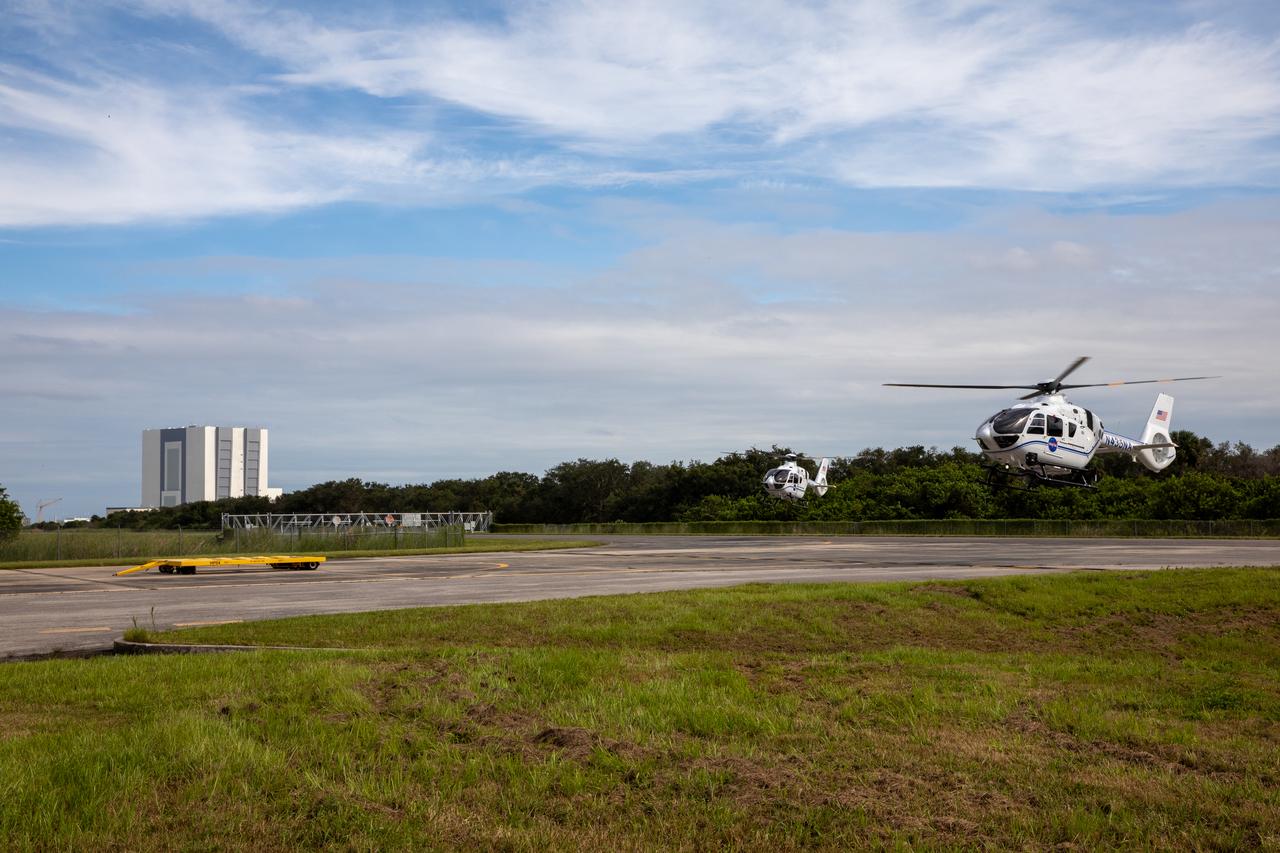 Two new Airbus H135 (T3) helicopters arrive at the Launch and Landing Facility runway at NASA’s Kennedy Space Center in Florida on Sept. 30, 2020. The H135 helicopters will replace the Bell Huey 2 security aircraft in service now, maintained by Kennedy’s Flight Operations team. These new helicopters provide a number of technological and safety advantages over the Hueys, such as more lifting power, greater stability in the air, and expanded medical capabilities. The team expects to fully transition to flying the two H135s later this year. A third is expected to arrive in early 2021, and with its arrival, will complete the fleet’s upgrade.