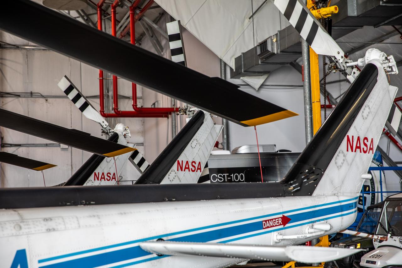 The three Bell Huey 2 helicopters utilized by Kennedy Space Center’s Flight Operations team for security purposes are photographed inside the Launch and Landing Facility hangar on Sept. 30, 2020. Two new Airbus H135 (T3) helicopters arrived at the Florida spaceport on Sept. 30 to replace the Bell Huey 2 aircraft in service now. The new helicopters provide a number of technological and safety advantages over the Hueys, such as more lifting power, greater stability in the air, and expanded medical capabilities. The team expects to fully transition to flying the two H135 aircraft later this year. A third is expected to arrive in early 2021, and with its arrival, will complete the fleet’s upgrade.