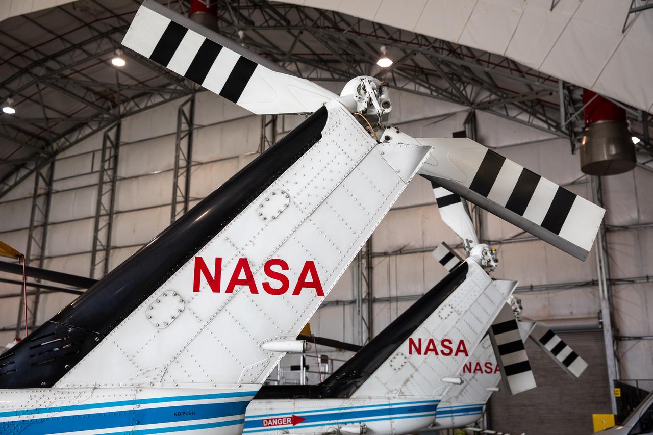 The three Bell Huey 2 helicopters utilized by Kennedy Space Center’s Flight Operations team for security purposes are photographed inside the Launch and Landing Facility hangar on Sept. 30, 2020. Two new Airbus H135 (T3) helicopters arrived at the Florida spaceport on Sept. 30 to replace the Bell Huey 2 aircraft in service now. The new helicopters provide a number of technological and safety advantages over the Hueys, such as more lifting power, greater stability in the air, and expanded medical capabilities. The team expects to fully transition to flying the two H135 aircraft later this year. A third is expected to arrive in early 2021, and with its arrival, will complete the fleet’s upgrade.