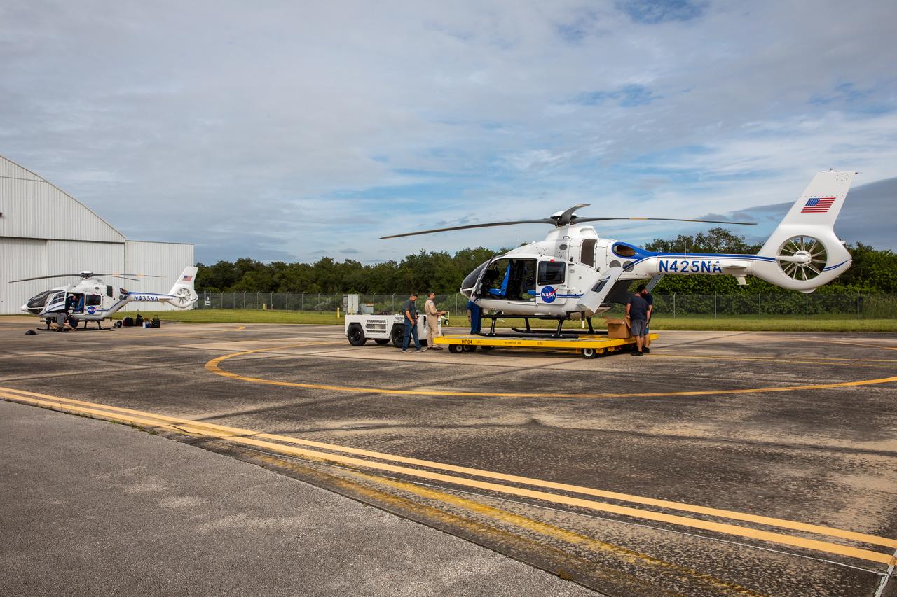 Two new Airbus H135 (T3) helicopters arrive at the Launch and Landing Facility runway at NASA’s Kennedy Space Center in Florida on Sept. 30, 2020. The H135 helicopters will replace the Bell Huey 2 security aircraft in service now, maintained by Kennedy’s Flight Operations team. These new helicopters provide a number of technological and safety advantages over the Hueys, such as more lifting power, greater stability in the air, and expanded medical capabilities. The team expects to fully transition to flying the two H135s later this year. A third is expected to arrive in early 2021, and with its arrival, will complete the fleet’s upgrade.