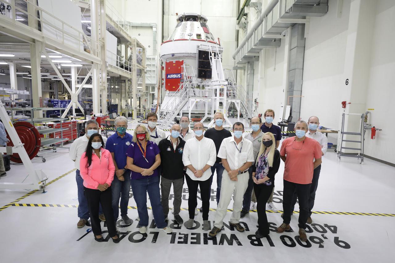 Members of the European Service Module processing team from NASA, the European Space Agency, Airbus, Airbus Netherlands, and Lockheed Martin are shown with Orion’s solar array wings installed on the spacecraft for Artemis I inside the Neil Armstrong Operations and Checkout Building high bay at NASA’s Kennedy Space Center in Florida on Sept. 30, 2020. The solar arrays were extended, inspected, and then retracted, before installation on the spacecraft. Each solar array panel will generate 11 kilowatts of power and span about 63 feet. The array is a component of Orion’s service module, which is provided by the European Space Agency and built by Airbus Defence and Space to supply Orion’s power, propulsion, air and water. The first in a series of increasingly complex missions, Artemis I will test the Orion spacecraft and Space Launch System as an integrated system ahead of crewed flights to the Moon. Under the Artemis program, NASA will land the first woman and the next man on the Moon in 2024.