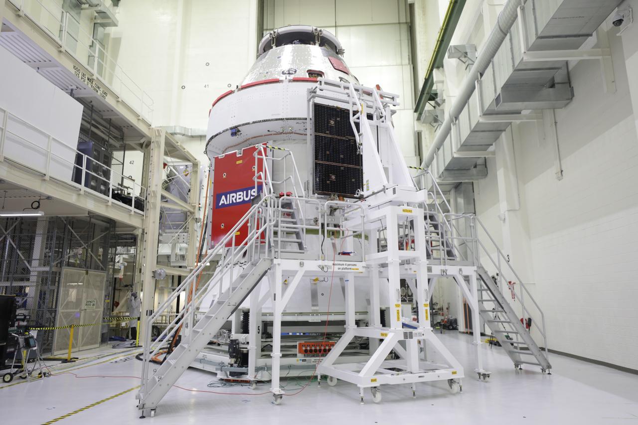 The final of four solar array wings is shown being installed prior to receiving its protective covering on the Orion spacecraft for Artemis I inside the Neil Armstrong Operations and Checkout Building high bay at NASA’s Kennedy Space Center in Florida on Sept. 30, 2020. The solar arrays were extended, inspected, and then retracted, before installation on the spacecraft. Each solar array panel will generate 11 kilowatts of power and span about 63 feet. The array is a component of Orion’s service module, which is provided by the European Space Agency and built by Airbus Defence and Space to supply Orion’s power, propulsion, air and water. The first in a series of increasingly complex missions, Artemis I will test the Orion spacecraft and Space Launch System as an integrated system ahead of crewed flights to the Moon. Under the Artemis program, NASA will land the first woman and the next man on the Moon in 2024.