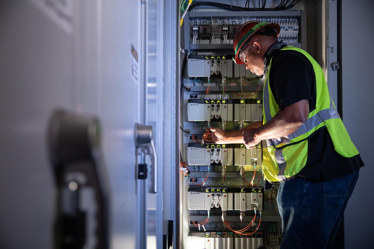 Reggie Martin, an engineer with Exploration Ground Systems, works on racks inside the mobile launcher at NASA’s Kennedy Space Center in Florida on Oct. 2, 2020. Software engineers are writing and testing new software for launch of the Space Launch System and Orion spacecraft for Artemis I.