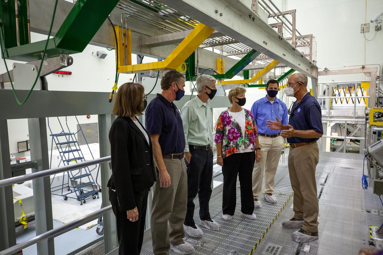 Catherine Koerner, far left, NASA Orion Program manager, along with senior managers from Orion, and Exploration Ground Systems (EGS), tours the Multi-Payload Processing Facility (MPPF) at NASA’s Kennedy Space Center in Florida on Oct. 5, 2020. Accompanying her, from left are Mike Bolger, EGS manager; Scott Wilson, Orion Production Operations manager; Annette Hasbrook, Orion Program assistant manager; and Jeremy Parsons, EGS deputy manager. Speaking to the group is Skip Williams, operations manager for the MPPF spacecraft offline element integration team. Koerner viewed spacecraft hardware and processing facilities for the Artemis I and II missions. The first in a series of increasingly complex missions, Artemis I will test the Orion spacecraft and Space Launch System as an integrated system ahead of crewed flights to the Moon. Under the Artemis program, NASA will land the first woman and the next man on the Moon in 2024.