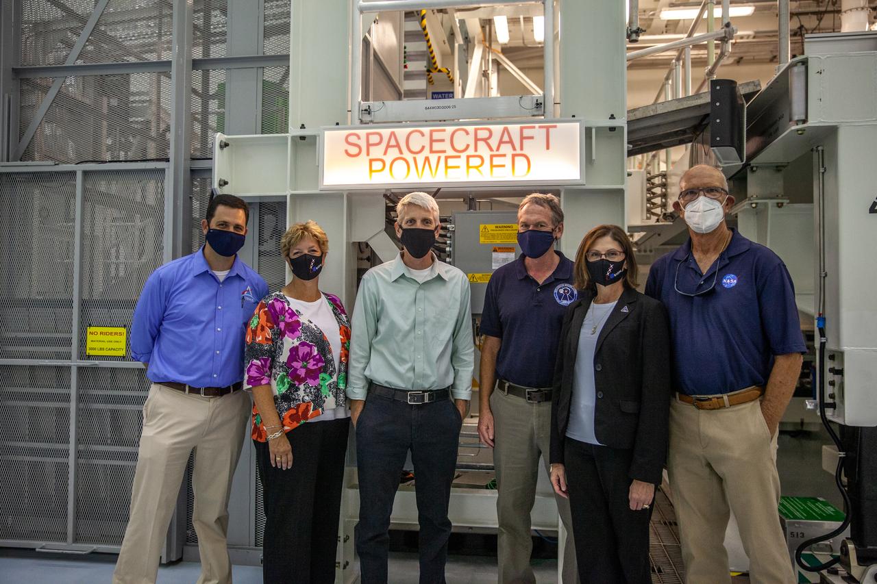 Catherine Koerner, second from right, NASA Orion Program manager, along with senior managers from Orion, and Exploration Ground Systems (EGS), tours the Multi-Payload Processing Facility (MPPF) at NASA’s Kennedy Space Center in Florida on Oct. 5, 2020. Accompanying her, from left are Jeremy Parsons, EGS deputy manager; Annette Hasbrook, Orion Program assistant manager; Scott Wilson, Orion Production Operations manager; and Mike Bolger, EGS manager. At far right is Skip Williams, operations manager for the MPPF spacecraft offline element integration team. Koerner viewed spacecraft hardware and processing facilities for the Artemis I and II missions. The first in a series of increasingly complex missions, Artemis I will test the Orion spacecraft and Space Launch System as an integrated system ahead of crewed flights to the Moon. Under the Artemis program, NASA will land the first woman and the next man on the Moon in 2024.