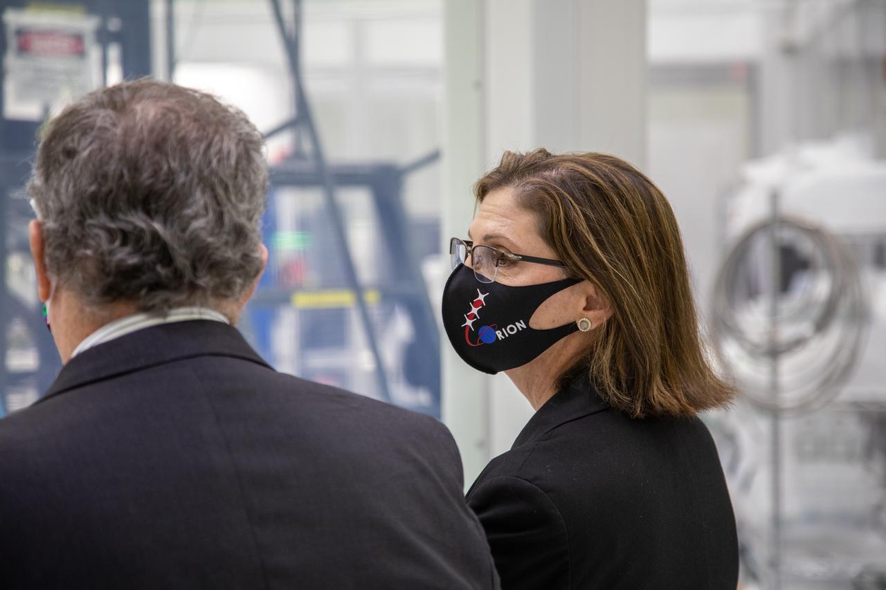 Catherine Koerner, at right, NASA Orion Program manager, along with senior managers from Orion and Lockheed Martin, tours the Neil Armstrong Operations and Checkout Building at NASA’s Kennedy Space Center in Florida on Oct. 6, 2020. Accompanying her, at left is Mike Hawes, Lockheed Martin vice president and Orion Program manager. Koerner viewed Orion spacecraft for the Artemis I and II missions. The first in a series of increasingly complex missions, Artemis I will test the Orion spacecraft and Space Launch System as an integrated system ahead of crewed flights to the Moon. Under the Artemis program, NASA will land the first woman and the next man on the Moon in 2024.