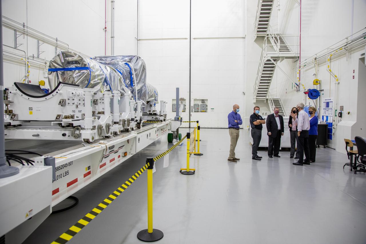 Catherine Koerner, third from right, NASA Orion Program manager, along with senior managers from Orion and Lockheed Martin, tour the Launch Abort System Facility at NASA’s Kennedy Space Center in Florida on Oct. 6, 2020. Accompanying her from left, are Jim Skaggs, Kennedy Operations senior manager with Lockheed Martin; Jules Schneider, Kennedy Assembly, Test and Launch Operations director with Lockheed Martin; Mike Hawes, Lockheed Martin vice president and Orion Program manager; Scott Wilson, NASA Kennedy Orion Production Operations manager; and Annette Hasbrook, Orion Program assistant manager. They are viewing the launch abort system for the Artemis II mission. Koerner also viewed the Orion spacecraft for the Artemis I and II missions in the Neil Armstrong Operations and Checkout Building. The first in a series of increasingly complex missions, Artemis I will test the Orion spacecraft and Space Launch System as an integrated system ahead of crewed flights to the Moon. Under the Artemis program, NASA will land the first woman and the next man on the Moon in 2024.
