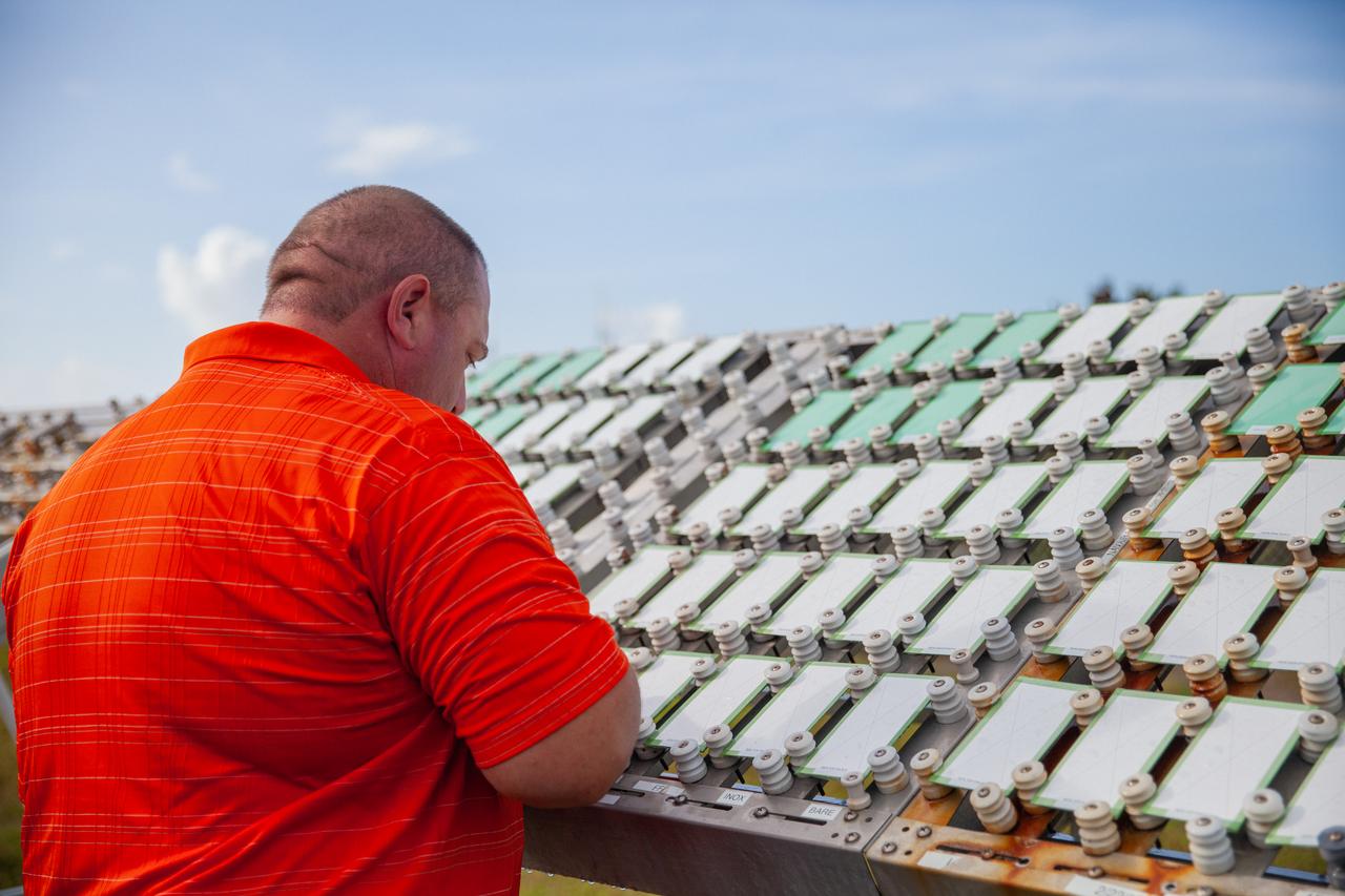 A Mechanical and Environmental Testing Lab engineer examines samples at the corrosion engineering test site at NASA’s Kennedy Space Center in Florida on Oct. 6, 2020. The corrosion lab is a network of people, equipment, and facilities that provides engineering services and technical innovations in all areas of corrosion for NASA and external customers.