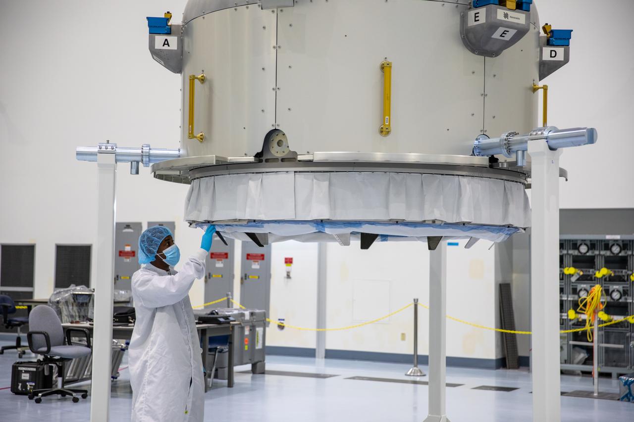 A Nanoracks technician works on the Nanoracks Bishop Airlock inside the Space Station Processing Facility at NASA's Kennedy Space Center in Florida on Oct. 7, 2020. The next-generation Nanoracks payload facility is being prepared for its flight to the International Space Station on SpaceX’s 21st commercial resupply services mission (CRS-21) to the International Space Station. The Bishop Airlock is the first commercially funded airlock for the space station. It will provide payload hosting, robotics testing, satellite deployment, and serve as an outside toolbox for station crew spacewalks, and more. CRS-21 is scheduled to launch on a SpaceX Falcon 9 from Kennedy’s Launch Complex 39A.
