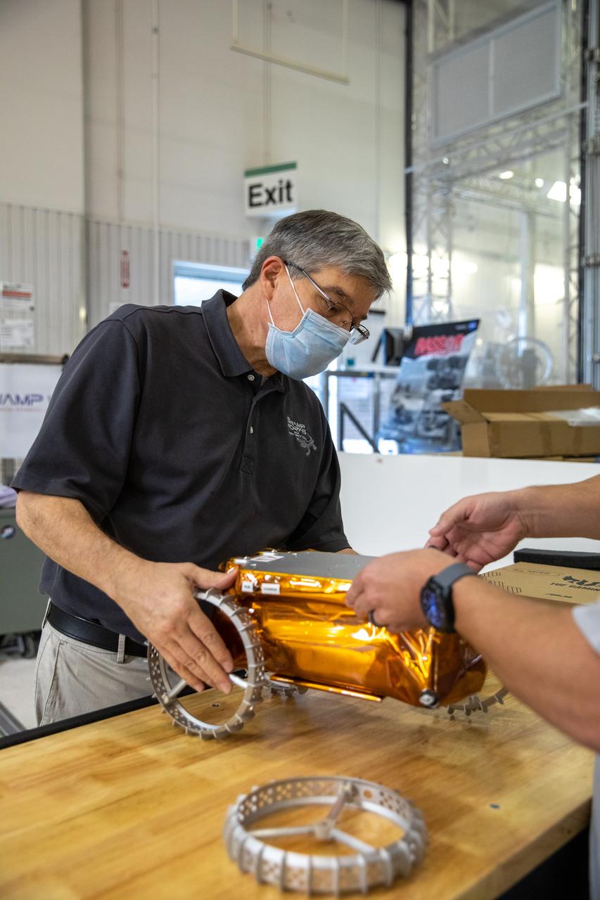 Jim Mantovani, with Kennedy Space Center’s Exploration and Research and Technology programs, unboxes a CubeRover at the Florida spaceport on Oct. 9, 2020. The rover was delivered by Pittsburgh-based space robotics company Astrobotic, as part of a Small Business Innovative Research (SBIR) award from NASA. Kennedy’s A.J. Nick will lead CubeRover testing in the coming months in the Granular Mechanics and Regolith Operations (GMRO) Laboratory’s regolith bin, which holds approximately 120 tons of lunar regolith simulant at Kennedy’s Swamp Works. In 2019, NASA announced a $2 million Tipping Point award to develop more mature CubeRover’s payload interfaces and increase its capabilities.