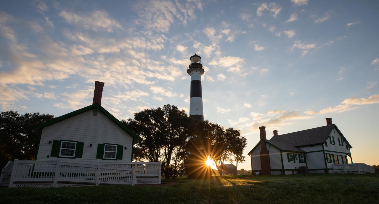 The sun rises behind Cape Canaveral Lighthouse at Cape Canaveral Air Force Station in Florida on Oct. 13, 2020.