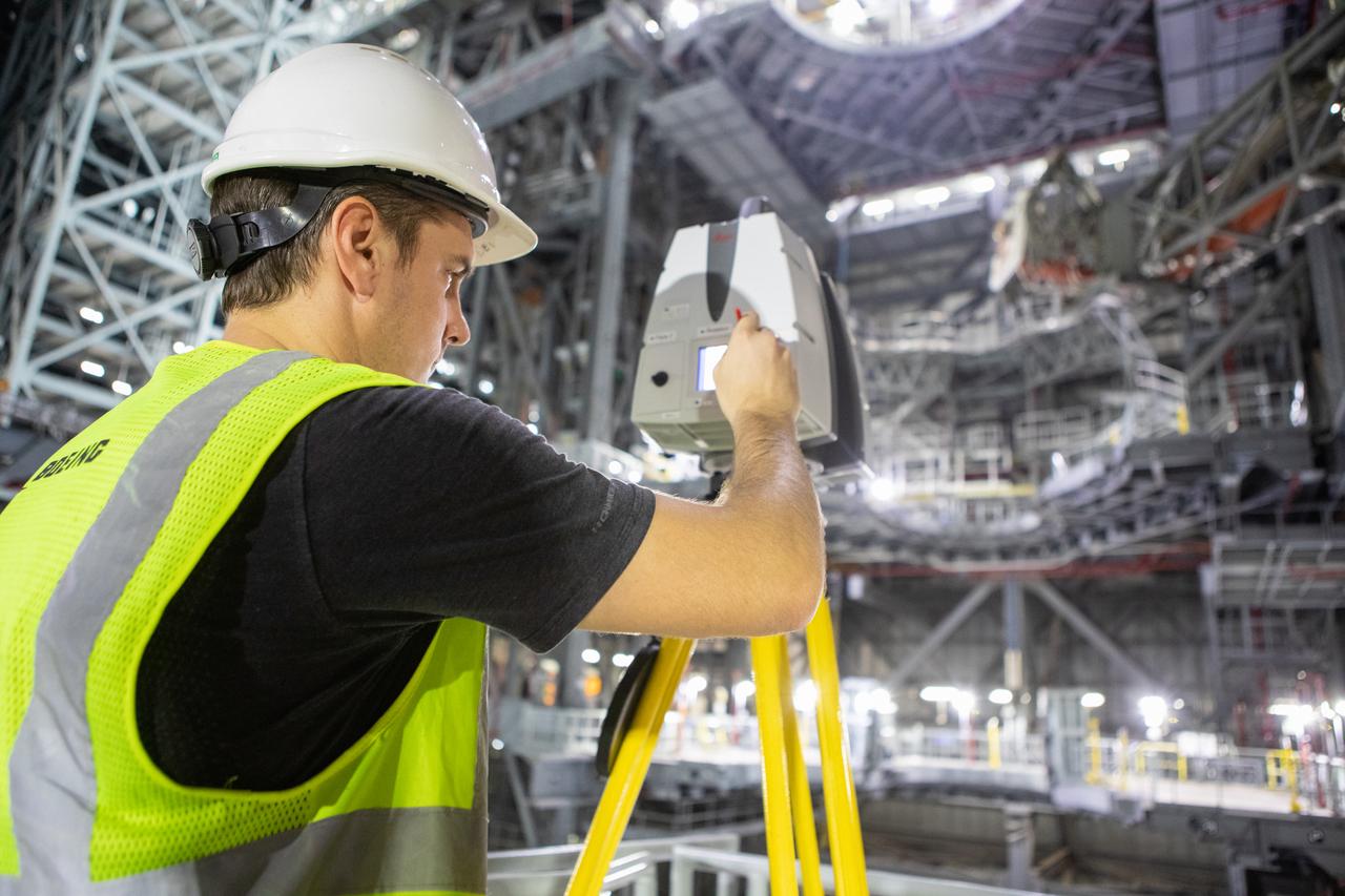 An engineer sets up equipment from the Design Visualization Lab inside High Bay 3 of the Vehicle Assembly Building at NASA’s Kennedy Space Center on Oct. 14, 2020. The equipment will be used to do 3-D modeling of the mobile launcher that will carry the Space Launch System and Orion spacecraft to Launch Complex 39B for the Artemis I mission. Artemis I will test the Orion spacecraft and SLS as an integrated system ahead of crewed flights to the Moon. Under the Artemis program, NASA will land the first woman and the next man on the Moon in 2024.
