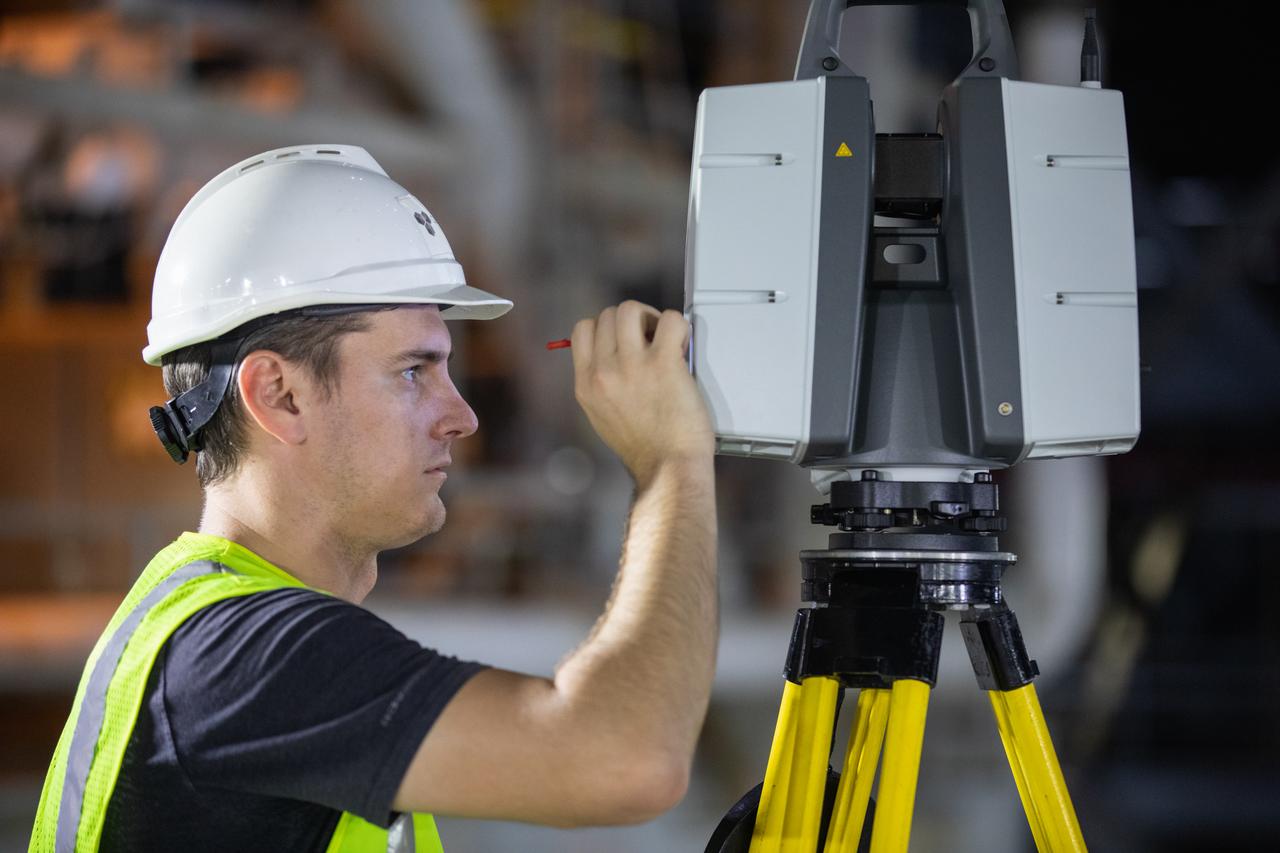 An engineer adjusts equipment from the Design Visualization Lab set up inside High Bay 3 of the Vehicle Assembly Building at NASA’s Kennedy Space Center on Oct. 14, 2020. The equipment will be used to do 3-D modeling of the mobile launcher that will carry the Space Launch System and Orion spacecraft to Launch Complex 39B for the Artemis I mission. Artemis I will test the Orion spacecraft and SLS as an integrated system ahead of crewed flights to the Moon. Under the Artemis program, NASA will land the first woman and the next man on the Moon in 2024.