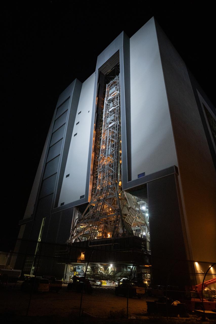 In the early morning on Oct. 20, 2020, the mobile launcher for the Artemis I mission begins its rollout atop crawler-transporter 2 from the Vehicle Assembly Building at NASA’s Kennedy Space Center in Florida. The nearly 400-foot-tall mobile launcher is being rolled to Launch Pad 39B. During its two-week stay at the pad, engineers with Exploration Ground Systems and Jacobs will perform several tasks, including a timing test to validate the launch team’s countdown timeline, and a thorough, top-to-bottom wash down of the mobile launcher to remove any debris remaining from construction and installation of the umbilical arms. Artemis I will test the Orion spacecraft and Space Launch System as an integrated system ahead of crewed flights to the Moon. Under the Artemis program, NASA will land the first woman and the next man on the Moon in 2024.