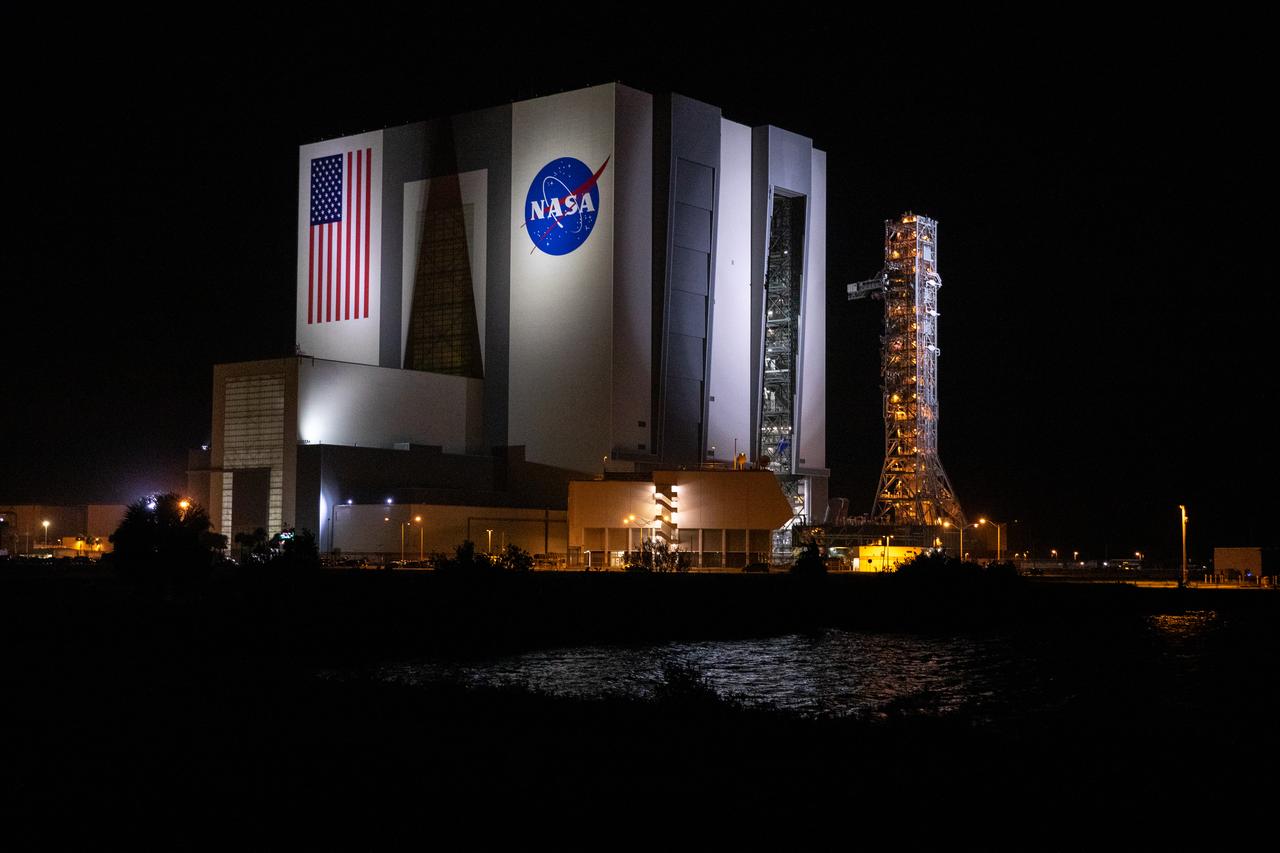 In the early morning on Oct. 20, 2020, the mobile launcher for the Artemis I mission begins its rollout atop crawler-transporter 2 from the Vehicle Assembly Building at NASA’s Kennedy Space Center in Florida. The nearly 400-foot-tall mobile launcher is being rolled to Launch Pad 39B. During its two-week stay at the pad, engineers with Exploration Ground Systems and Jacobs will perform several tasks, including a timing test to validate the launch team’s countdown timeline, and a thorough, top-to-bottom wash down of the mobile launcher to remove any debris remaining from construction and installation of the umbilical arms. Artemis I will test the Orion spacecraft and Space Launch System as an integrated system ahead of crewed flights to the Moon. Under the Artemis program, NASA will land the first woman and the next man on the Moon in 2024.