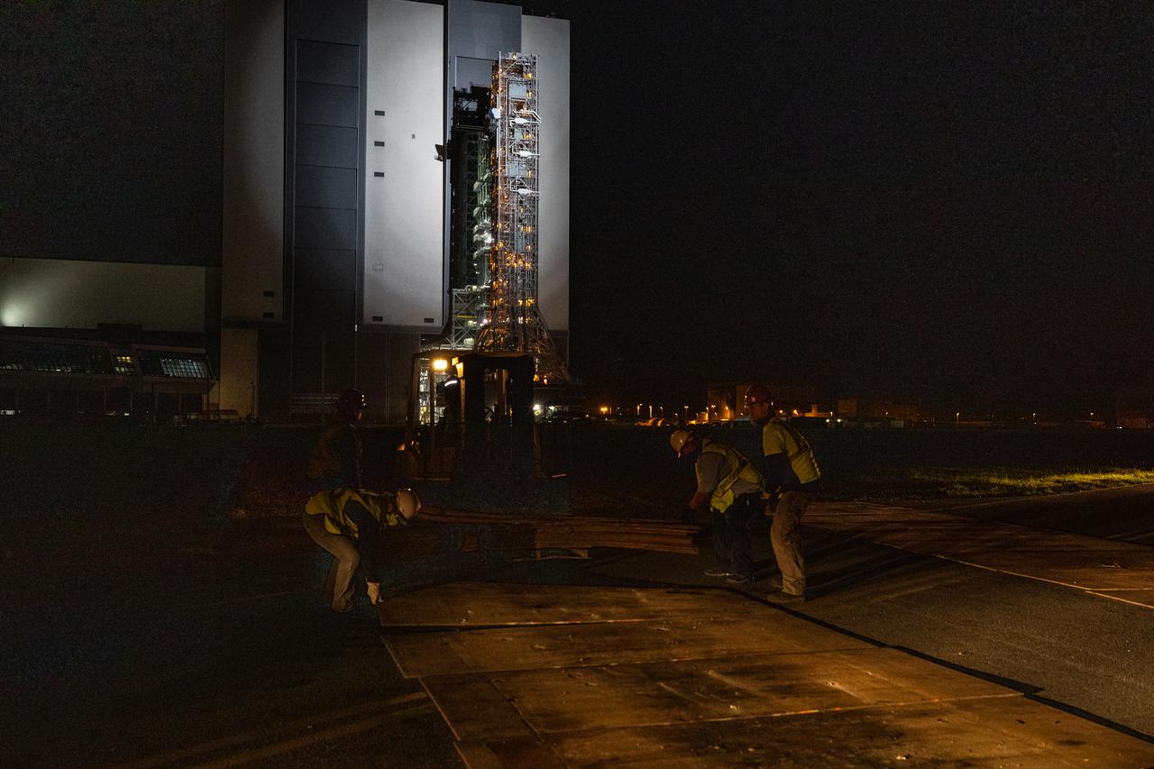 In the early morning on Oct. 20, 2020, the mobile launcher for the Artemis I mission begins its rollout atop crawler-transporter 2 from the Vehicle Assembly Building at NASA’s Kennedy Space Center in Florida. The nearly 400-foot-tall mobile launcher is being rolled to Launch Pad 39B. During its two-week stay at the pad, engineers with Exploration Ground Systems and Jacobs will perform several tasks, including a timing test to validate the launch team’s countdown timeline, and a thorough, top-to-bottom wash down of the mobile launcher to remove any debris remaining from construction and installation of the umbilical arms. Artemis I will test the Orion spacecraft and Space Launch System as an integrated system ahead of crewed flights to the Moon. Under the Artemis program, NASA will land the first woman and the next man on the Moon in 2024.