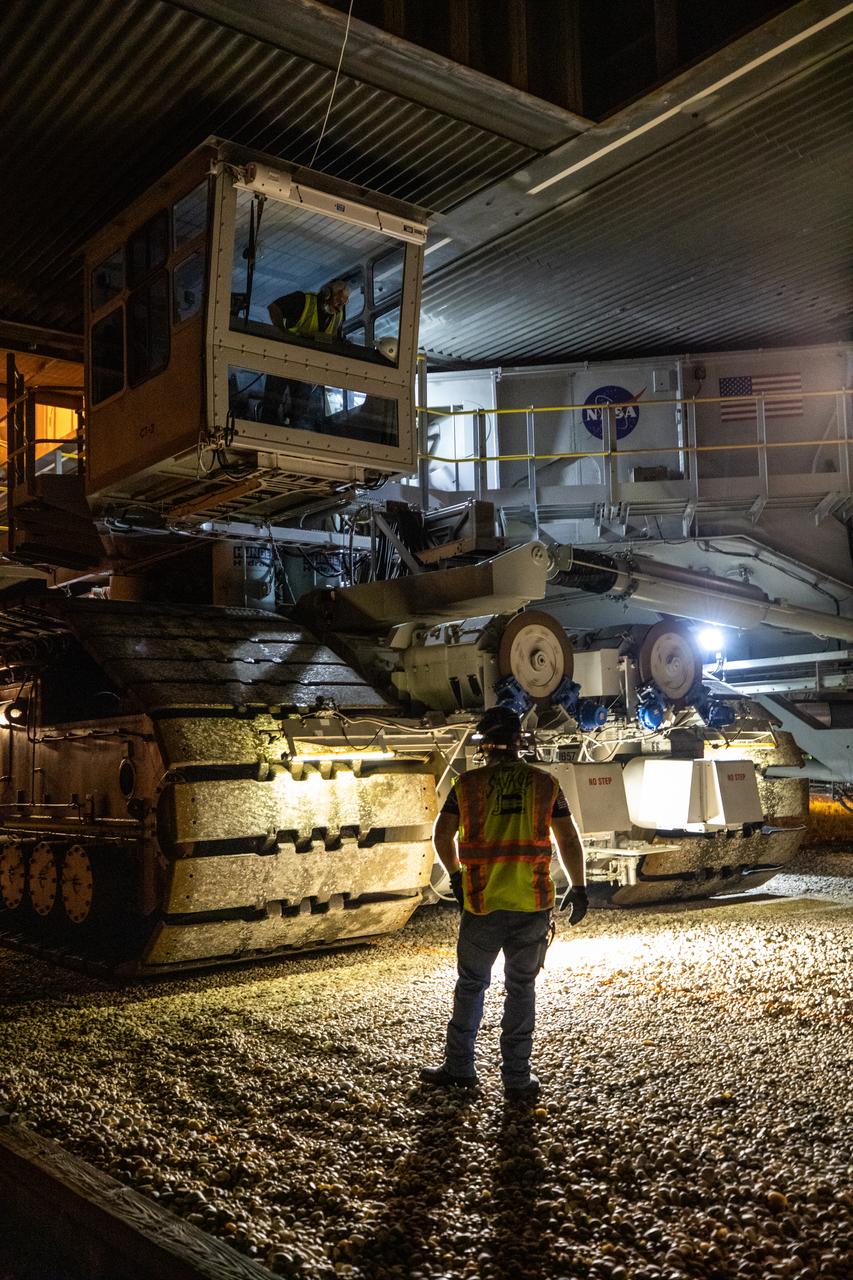 A close-up view of crawler-transporter 2 as it moves slowly along the crawlerway carrying the mobile launcher for the Artemis I mission after departing the Vehicle Assembly Building at NASA’s Kennedy Space Center in Florida in the early morning on Oct. 20, 2020. The nearly 400-foot-tall mobile launcher is being rolled to Launch Pad 39B. During its two-week stay at the pad, engineers with Exploration Ground Systems and Jacobs will perform several tasks, including a timing test to validate the launch team’s countdown timeline, and a thorough, top-to-bottom wash down of the mobile launcher to remove any debris remaining from construction and installation of the umbilical arms. Artemis I will test the Orion spacecraft and Space Launch System as an integrated system ahead of crewed flights to the Moon. Under the Artemis program, NASA will land the first woman and the next man on the Moon in 2024.