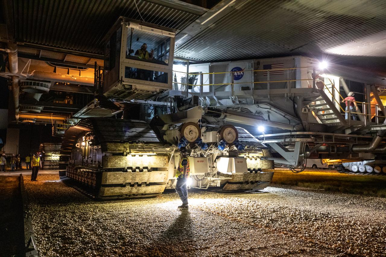 A close-up view of crawler-transporter 2 as it moves slowly along the crawlerway carrying the mobile launcher for the Artemis I mission after departing the Vehicle Assembly Building at NASA’s Kennedy Space Center in Florida in the early morning on Oct. 20, 2020. The nearly 400-foot-tall mobile launcher is being rolled to Launch Pad 39B. During its two-week stay at the pad, engineers with Exploration Ground Systems and Jacobs will perform several tasks, including a timing test to validate the launch team’s countdown timeline, and a thorough, top-to-bottom wash down of the mobile launcher to remove any debris remaining from construction and installation of the umbilical arms. Artemis I will test the Orion spacecraft and Space Launch System as an integrated system ahead of crewed flights to the Moon. Under the Artemis program, NASA will land the first woman and the next man on the Moon in 2024.