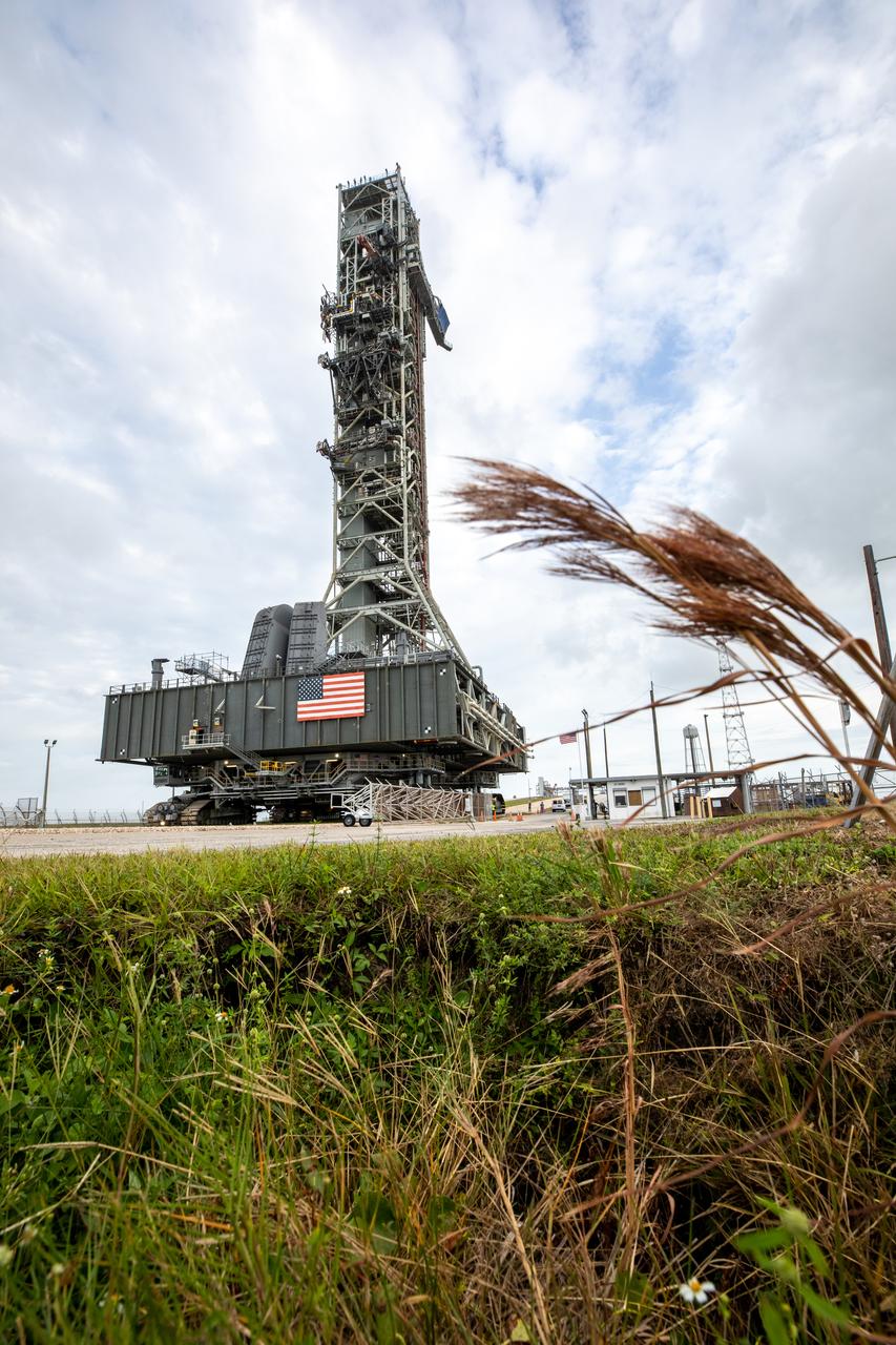 During sunrise on Oct. 20, 2020, the mobile launcher for the Artemis I mission, atop crawler-transporter 2, travels up the ramp leading to the top of Launch Pad 39B at NASA’s Kennedy Space Center in Florida. The nearly 400-foot-tall mobile launcher will remain at the pad for two weeks, while engineers with Exploration Ground Systems and Jacobs will perform several tasks, including a timing test to validate the launch team’s countdown timeline, and a thorough, top-to-bottom wash down of the mobile launcher to remove any debris remaining from construction and installation of the umbilical arms. Artemis I will test the Orion spacecraft and Space Launch System as an integrated system ahead of crewed flights to the Moon. Under the Artemis program, NASA will land the first woman and the next man on the Moon in 2024.