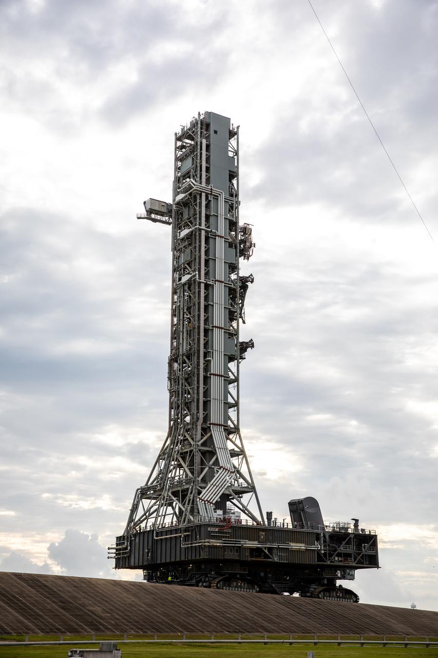 During the morning on Oct. 20, 2020, the mobile launcher for the Artemis I mission, atop crawler-transporter 2, moves up the ramp leading to Launch Pad 39B at NASA’s Kennedy Space Center in Florida. The nearly 400-foot-tall mobile launcher will remain at the pad for two weeks, while engineers with Exploration Ground Systems and Jacobs will perform several tasks, including a timing test to validate the launch team’s countdown timeline, and a thorough, top-to-bottom wash down of the mobile launcher to remove any debris remaining from construction and installation of the umbilical arms. Artemis I will test the Orion spacecraft and Space Launch System as an integrated system ahead of crewed flights to the Moon. Under the Artemis program, NASA will land the first woman and the next man on the Moon in 2024.