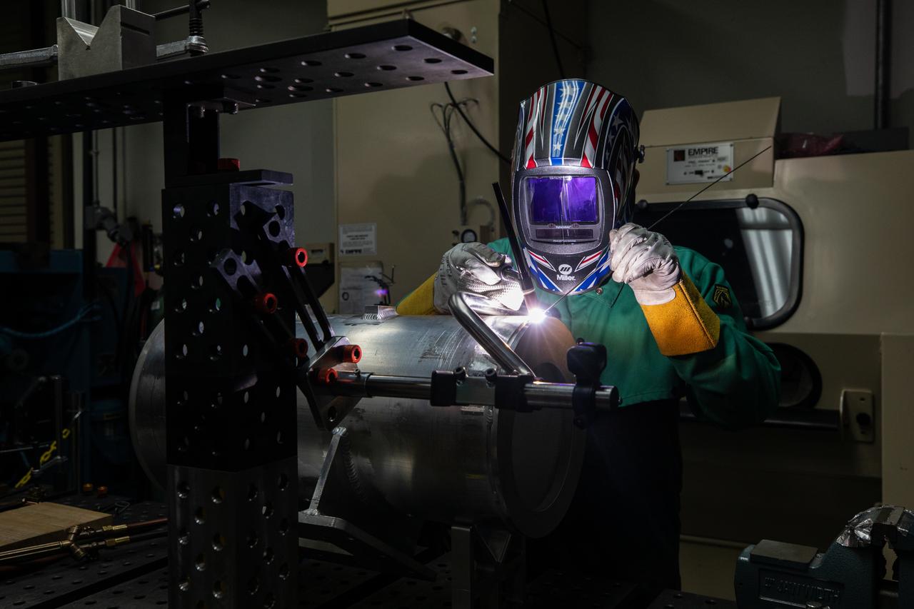 Spencer Wells, a mechanical engineering technician, welds a part of a camera enclosure which will be used at Launch Complex 39B inside the Prototype Development Laboratory at NASA’s Kennedy Space Center in Florida on Oct. 21, 2020. The prototype laboratory designs, fabricates, and tests prototypes, test articles and test support equipment. It has a long history of providing fast solutions to complex operations problems. The lab’s teams of engineers use specialized equipment to produce exacting, one-of-a-kind items made from a range of materials depending on the design. The lab supports projects at Kennedy and at the agency level.