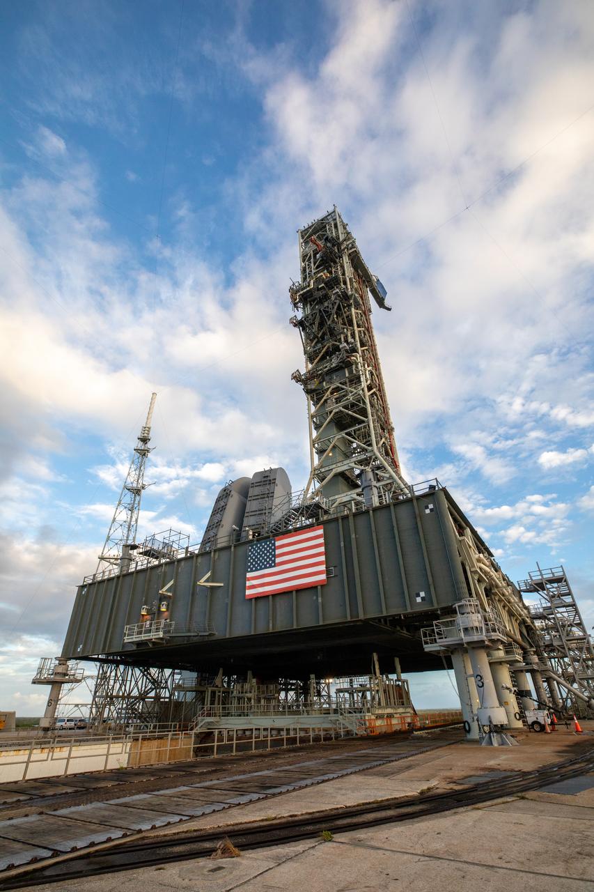 The mobile launcher for the Artemis I mission is in view on the top of Launch Pad 39B at NASA’s Kennedy Space Center in Florida on Oct. 23, 2020. The nearly 400-foot-tall mobile launcher is at the pad to allow engineers with Exploration Ground Systems and Jacobs to complete several tasks, including a timing test to validate the launch team’s countdown timeline, and a thorough, top-to-bottom wash down of the mobile launcher to remove any debris remaining from construction and installation of the umbilical arms. Artemis I will test the Orion spacecraft and Space Launch System as an integrated system ahead of crewed flights to the Moon. Under the Artemis program, NASA will land the first woman and the next man on the Moon in 2024.