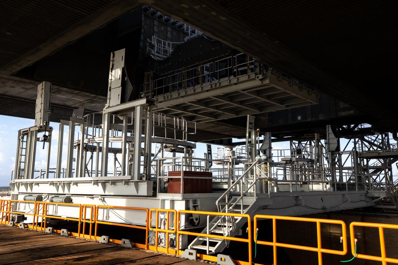 The engine service platform is moved into position beneath the mobile launcher for Artemis I at Launch Pad 39B on Oct. 23, 2020, at NASA’s Kennedy Space Center in Florida. The service platform allows access to the RS-25 engines on the Space Launch System core stage for routine work or inspections. The nearly 400-foot-tall mobile launcher will remain at the pad while engineers with Exploration Ground Systems and Jacobs complete several tasks, including a timing test to validate the launch team’s countdown timeline, and a thorough, top-to-bottom wash down of the mobile launcher to remove any debris remaining from construction and installation of the umbilical arms. Artemis I will test the Orion spacecraft and Space Launch System as an integrated system ahead of crewed flights to the Moon. Under the Artemis program, NASA will land the first woman and the next man on the Moon in 2024.