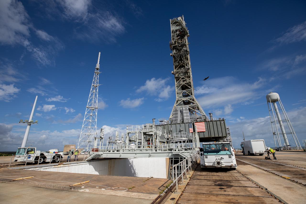 A view of the mobile launcher for the Artemis I mission at Launch Pad 39B at NASA’s Kennedy Space Center in Florida on Oct. 23, 2020. The nearly 400-foot-tall mobile launcher is at the pad while engineers with Exploration Ground Systems and Jacobs complete several tasks, including a timing test to validate the launch team’s countdown timeline, and a thorough, top-to-bottom wash down of the mobile launcher to remove any debris remaining from construction and installation of the umbilical arms. Artemis I will test the Orion spacecraft and Space Launch System as an integrated system ahead of crewed flights to the Moon. Under the Artemis program, NASA will land the first woman and the next man on the Moon in 2024.