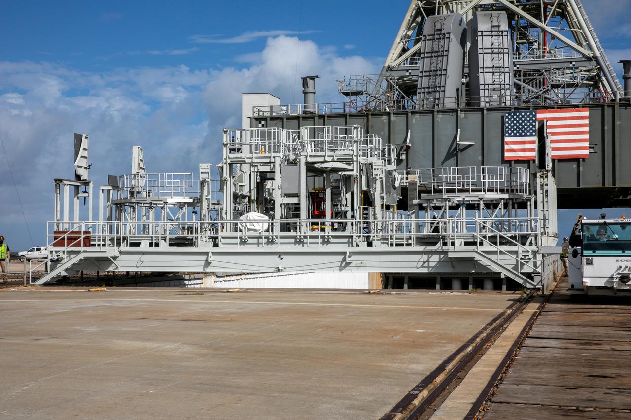 The engine service platform has been lowered and removed from underneath the mobile launcher for Artemis I at Launch Pad 39B at NASA’s Kennedy Space Center in Florida on Oct. 23, 2020. The nearly 400-foot-tall mobile launcher is at the pad while engineers with Exploration Ground Systems and Jacobs complete several tasks, including a timing test to validate the launch team’s countdown timeline, and a thorough, top-to-bottom wash down of the mobile launcher to remove any debris remaining from construction and installation of the umbilical arms. Artemis I will test the Orion spacecraft and Space Launch System as an integrated system ahead of crewed flights to the Moon. Under the Artemis program, NASA will land the first woman and the next man on the Moon in 2024.
