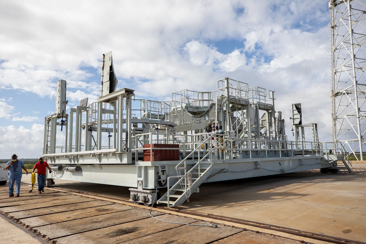 The engine service platform has been lowered and removed from the mobile launcher for Artemis I at Launch Pad 39B at NASA’s Kennedy Space Center in Florida on Oct. 23, 2020. It is staged on the top of the pad. The nearly 400-foot-tall mobile launcher is at the pad while engineers with Exploration Ground Systems and Jacobs complete several tasks, including a timing test to validate the launch team’s countdown timeline, and a thorough, top-to-bottom wash down of the mobile launcher to remove any debris remaining from construction and installation of the umbilical arms. Artemis I will test the Orion spacecraft and Space Launch System as an integrated system ahead of crewed flights to the Moon. Under the Artemis program, NASA will land the first woman and the next man on the Moon in 2024.