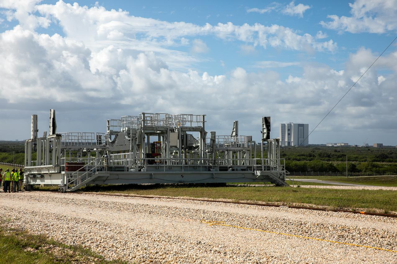 The engine service platform has been lowered and removed from the mobile launcher for Artemis I at Launch Pad 39B at NASA’s Kennedy Space Center in Florida on Oct. 23, 2020. It is being moved from the pad. The nearly 400-foot-tall mobile launcher is at the pad while engineers with Exploration Ground Systems and Jacobs complete several tasks, including a timing test to validate the launch team’s countdown timeline, and a thorough, top-to-bottom wash down of the mobile launcher to remove any debris remaining from construction and installation of the umbilical arms. Artemis I will test the Orion spacecraft and Space Launch System as an integrated system ahead of crewed flights to the Moon. Under the Artemis program, NASA will land the first woman and the next man on the Moon in 2024.