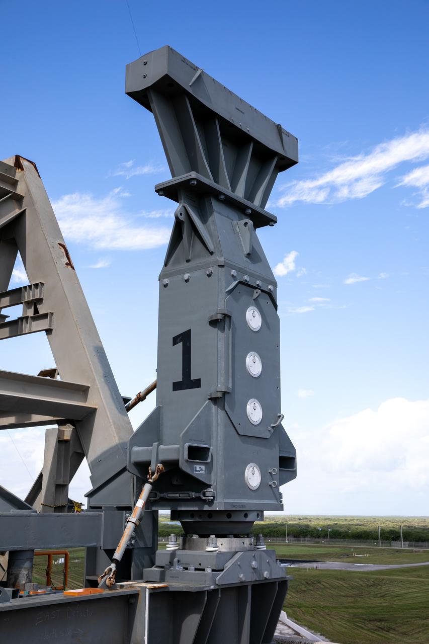Special ground support equipment is used to move the side flame deflectors into place during a countdown demonstration test using the mobile launcher for the Artemis I mission at Launch Pad 39B at NASA’s Kennedy Space Center in Florida on Oct. 23, 2020. The nearly 400-foot-tall mobile launcher is at the pad while engineers with Exploration Ground Systems and Jacobs complete several tasks, including a timing test to validate the launch team’s countdown timeline, and a thorough, top-to-bottom wash down of the mobile launcher to remove any debris remaining from construction and installation of the umbilical arms. Artemis I will test the Orion spacecraft and Space Launch System as an integrated system ahead of crewed flights to the Moon. Under the Artemis program, NASA will land the first woman and the next man on the Moon in 2024.