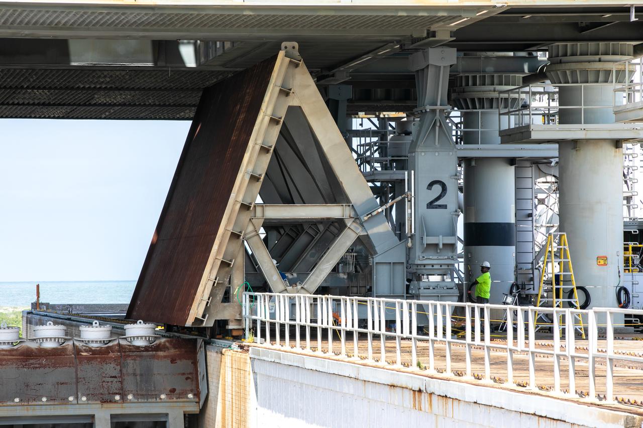 A close-up view of the base of one of the side flame deflectors positioned underneath the mobile launcher for Artemis I during a countdown demonstration test at Launch Pad 39B at NASA’s Kennedy Space Center in Florida on Oct. 23, 2020. The nearly 400-foot-tall mobile launcher is at the pad while engineers with Exploration Ground Systems and Jacobs complete several tasks, including a timing test to validate the launch team’s countdown timeline, and a thorough, top-to-bottom wash down of the mobile launcher to remove any debris remaining from construction and installation of the umbilical arms. Artemis I will test the Orion spacecraft and Space Launch System as an integrated system ahead of crewed flights to the Moon. Under the Artemis program, NASA will land the first woman and the next man on the Moon in 2024.