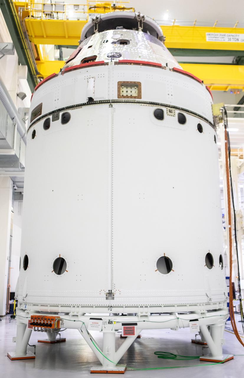 The spacecraft adapter jettison fairing panels are secured onto Orion’s European Service Module (ESM) on Oct. 27, 2020, inside the Neil Armstrong Operations and Checkout Building (O&C) at NASA’s Kennedy Space Center in Florida. The three panels were inspected and moved into place for installation by technicians with Lockheed Martin. Recently, teams from across the globe installed the four solar array wings, which are housed inside the protective covering of the fairings. The fairing panels will encapsulate the ESM to protect it from harsh environments such as heat, wind, and acoustics as the spacecraft is propelled out of Earth’s atmosphere atop the Space Launch System rocket during NASA’s Artemis I mission.