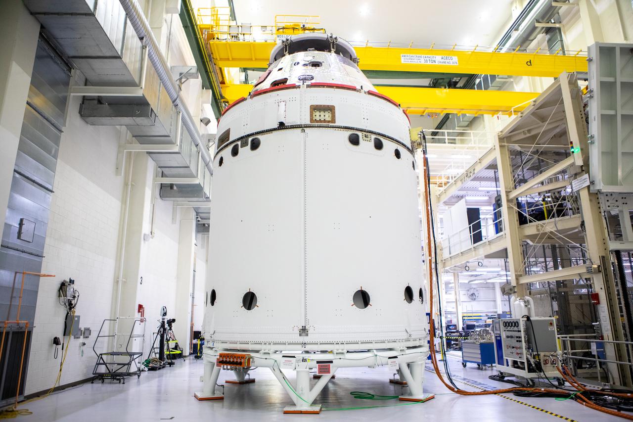 The spacecraft adapter jettison fairing panels are secured onto Orion’s European Service Module (ESM) on Oct. 27, 2020, inside the Neil Armstrong Operations and Checkout Building (O&C) at NASA’s Kennedy Space Center in Florida. The three panels were inspected and moved into place for installation by technicians with Lockheed Martin. Recently, teams from across the globe installed the four solar array wings, which are housed inside the protective covering of the fairings. The fairing panels will encapsulate the ESM to protect it from harsh environments such as heat, wind, and acoustics as the spacecraft is propelled out of Earth’s atmosphere atop the Space Launch System rocket during NASA’s Artemis I mission.