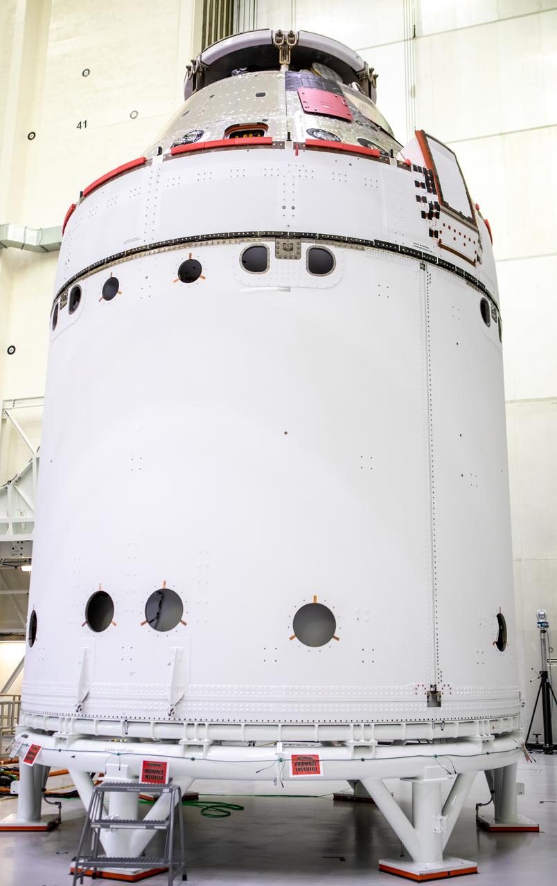 The spacecraft adapter jettison fairing panels are secured onto Orion’s European Service Module (ESM) on Oct. 27, 2020, inside the Neil Armstrong Operations and Checkout Building (O&C) at NASA’s Kennedy Space Center in Florida. The three panels were inspected and moved into place for installation by technicians with Lockheed Martin. Recently, teams from across the globe installed the four solar array wings, which are housed inside the protective covering of the fairings. The fairing panels will encapsulate the ESM to protect it from harsh environments such as heat, wind, and acoustics as the spacecraft is propelled out of Earth’s atmosphere atop the Space Launch System rocket during NASA’s Artemis I mission.