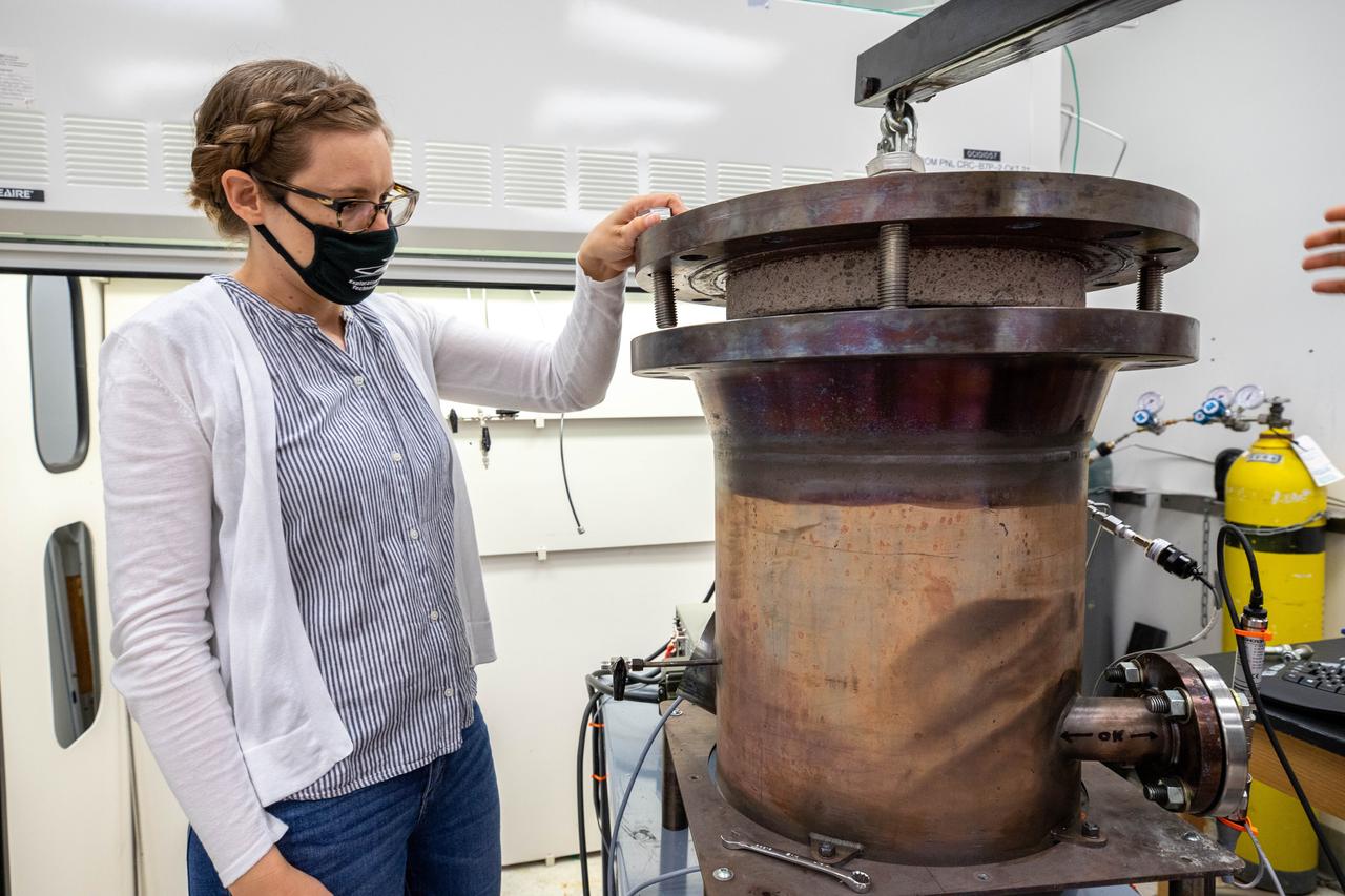 Elspeth Petersen, a chemical engineer and member of the Gaseous Lunar Oxygen from Regolith Electrolysis (GaLORE) project team at NASA’s Kennedy Space Center in Florida, inspects the GaLORE hardware that will be used to melt lunar regolith – dirt and dust on the Moon made from crushed rock – simulants during a test inside a laboratory at Kennedy’s Neil Armstrong Operations and Checkout Building on Oct. 29, 2020. GaLORE was selected as an Early Career Initiative project by the agency’s Space Technology Mission directorate, and the team was tasked with developing a device that could melt lunar regolith and turn it into oxygen. As NASA prepares to land the first woman and the next man on the Moon in 2024 as part of the Artemis program, technology such as this can assist with sustainable human lunar exploration and long-duration missions to Mars. 