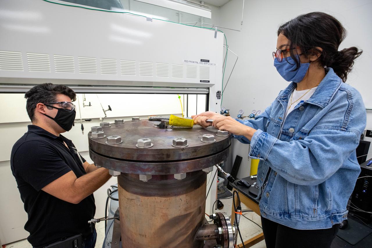 Members of the Gaseous Lunar Oxygen from Regolith Electrolysis (GaLORE) project team inspect hardware that will be used to melt lunar regolith – dirt and dust on the Moon made from crushed rock – simulants during a test inside a laboratory in the Neil Armstrong Operations and Checkout Building at NASA’s Kennedy Space Center in Florida on Oct. 29, 2020. GaLORE was selected as an Early Career Initiative project by the agency’s Space Technology Mission directorate, and the team was tasked with developing a device that could melt lunar regolith and turn it into oxygen. As NASA prepares to land the first woman and the next man on the Moon in 2024 as part of the Artemis program, technology such as this can assist with sustainable human lunar exploration and long-duration missions to Mars. 