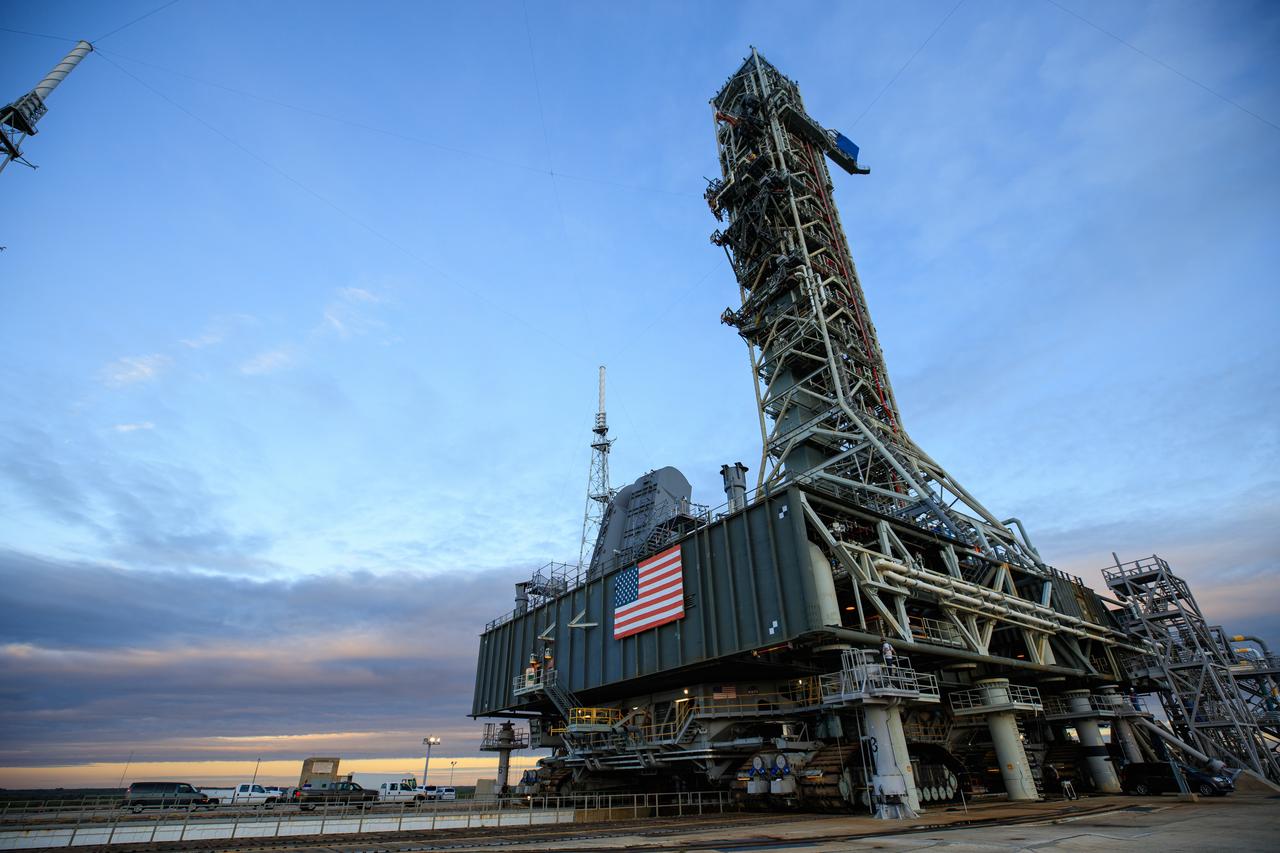 On Oct. 30, 2020, preparations are underway for the mobile launcher for the Artemis I mission, atop crawler-transporter 2, to depart Launch Pad 39B and return to the Vehicle Assembly Building at NASA’s Kennedy Space Center in Florida. The nearly 400-foot-tall mobile launcher was at the pad for 10 days, while engineers with Exploration Ground Systems and Jacobs performed several tasks, including a timing test to validate the launch team’s countdown timeline, and a thorough, top-to-bottom wash down of the mobile launcher to remove any debris remaining from construction and installation of the umbilical arms. Artemis I will test the Orion spacecraft and Space Launch System as an integrated system ahead of crewed flights to the Moon. Under the Artemis program, NASA will land the first woman and the next man on the Moon in 2024.
