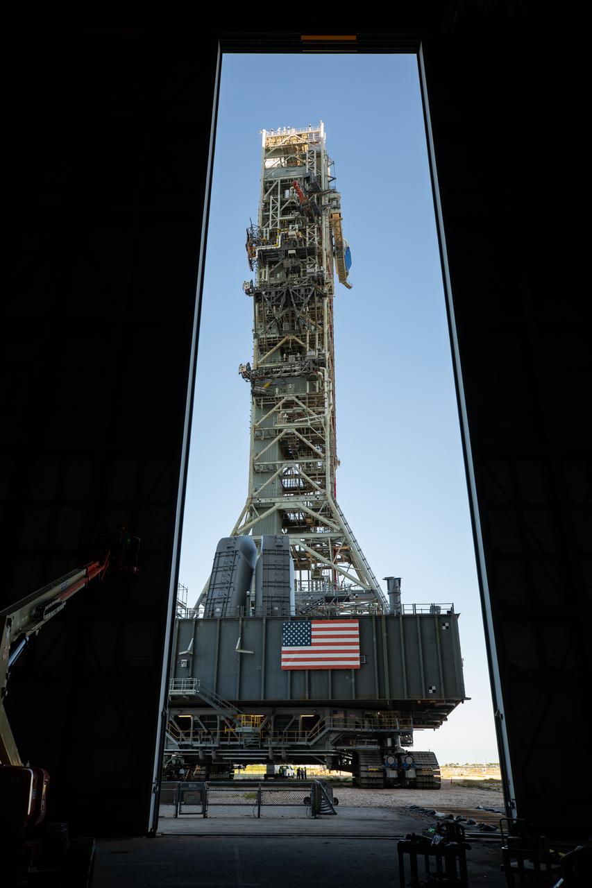 The mobile launcher for the Artemis I mission, atop crawler-transporter 2, arrives at the Vehicle Assembly Building at NASA’s Kennedy Space Center in Florida on Oct. 30, 2020. The nearly 400-foot-tall mobile launcher was at Launch Pad 39B for 10 days, while engineers with Exploration Ground Systems and Jacobs performed several tasks, including a timing test to validate the launch team’s countdown timeline, and a thorough, top-to-bottom wash down of the mobile launcher to remove any debris remaining from construction and installation of the umbilical arms. Artemis I will test the Orion spacecraft and Space Launch System as an integrated system ahead of crewed flights to the Moon. Under the Artemis program, NASA will land the first woman and the next man on the Moon in 2024. 