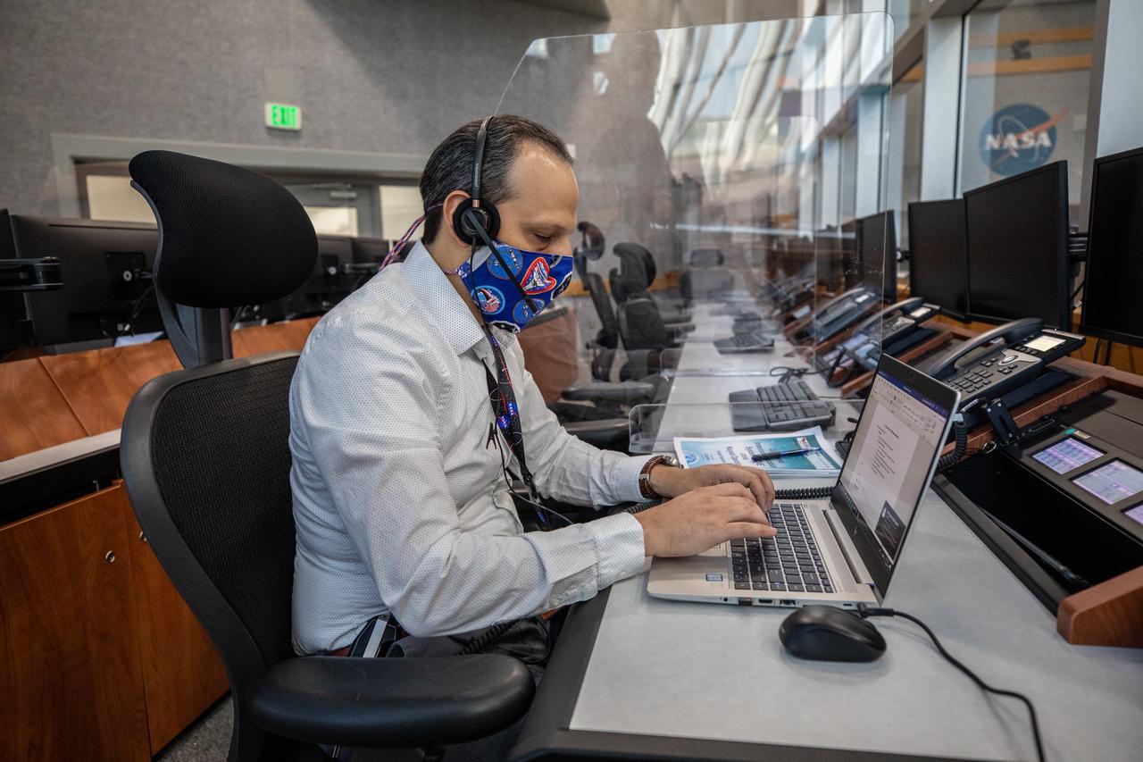 Pete Dizuzio, a system safety engineer, participates in a cryogenic propellant loading simulation inside Firing Room 1 in the Launch Control Center on Nov. 2, 2020, at NASA’s Kennedy Space Center in Florida. A team of engineers with Exploration Ground Systems and Jacobs, members of the cryogenics launch team, are rehearsing the steps to load the super-cooled liquid hydrogen and liquid oxygen into the Space Launch System’s (SLS) core and second stages to prepare for Artemis I. The first in a series of increasingly complex missions, Artemis I will test the Orion spacecraft and Space Launch System as an integrated system ahead of crewed flights to the Moon. NASA will land the first woman and the next man on the Moon in 2024.