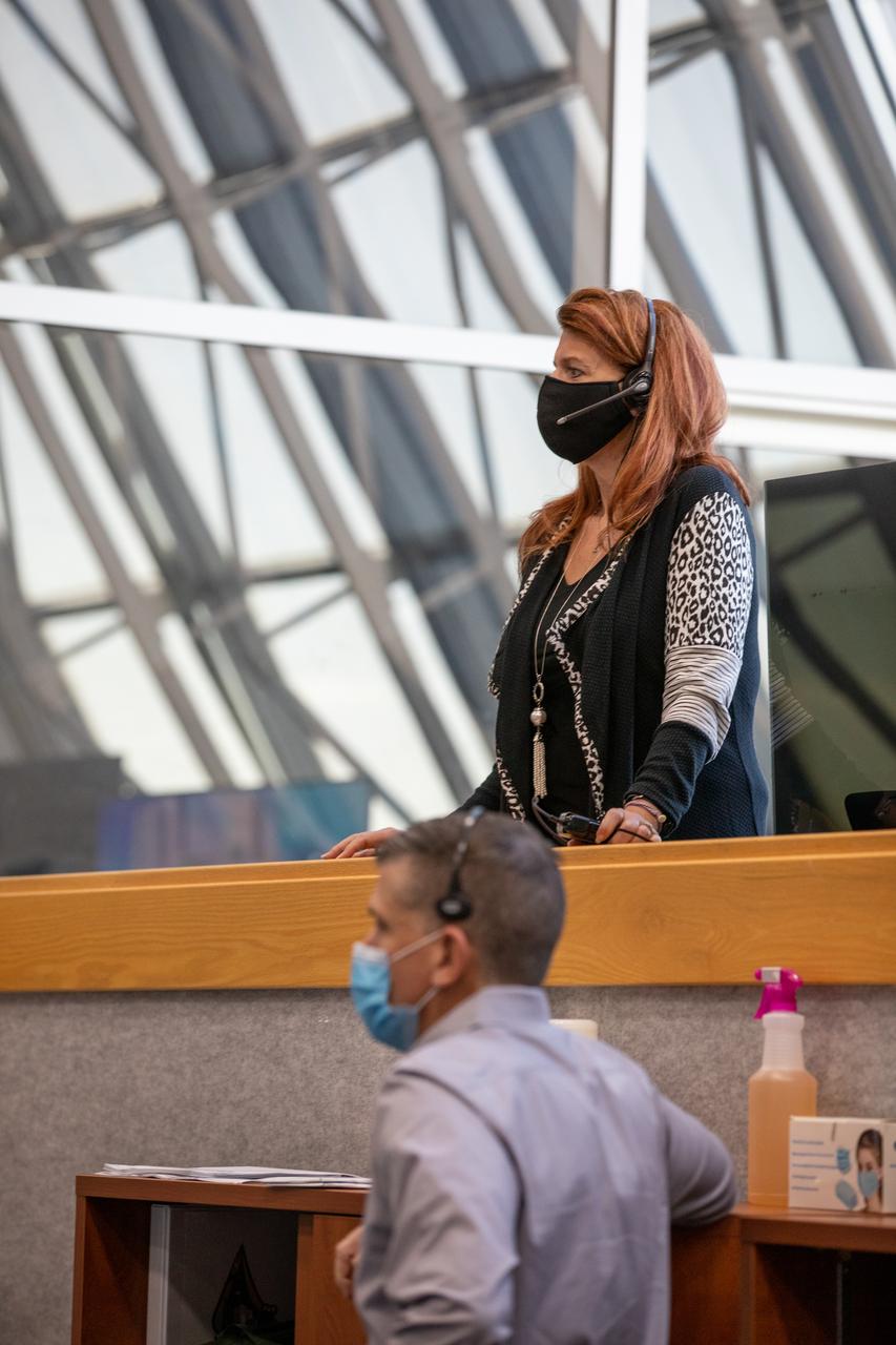 Charlie Blackwell-Thompson, standing, NASA Artemis launch director; and Jeremy Graeber, chief of the Test, Launch and Recovery Operations Branch within Exploration Ground Systems (EGS), monitor a cryogenic propellant loading simulation inside Firing Room 1 in the Launch Control Center on Nov. 2, 2020, at NASA’s Kennedy Space Center in Florida. A team of engineers with EGS and Jacobs, members of the cryogenics launch team, are rehearsing the steps to load the super-cooled liquid hydrogen and liquid oxygen into the Space Launch System’s (SLS) core and second stages to prepare for Artemis I. The first in a series of increasingly complex missions, Artemis I will test the Orion spacecraft and Space Launch System as an integrated system ahead of crewed flights to the Moon. NASA will land the first woman and the next man on the Moon in 2024.