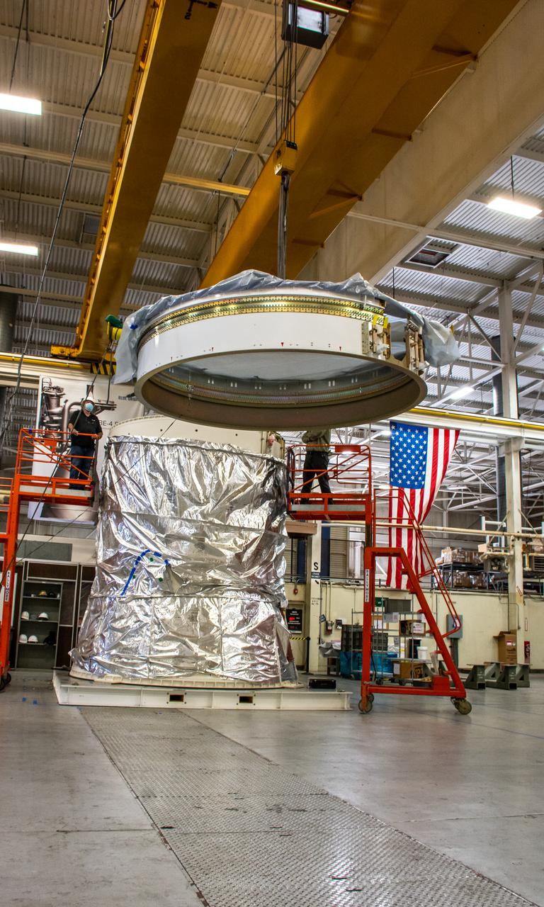 Inside Building 7525, a processing facility at Vandenberg Space Force Base in California, the aft stub adapter is lifted for mating to the interstage adapter for the United Launch Alliance Atlas V rocket on Nov. 4, 2020. The Atlas V will launch NASA’s Landsat 9 satellite from Vandenberg in September 2021. The launch is being managed by NASA’s Launch Services Program based at Kennedy Space Center. Landsat 9 will continue the nearly 50-year legacy of previous Landsat missions. It will monitor key natural and economic resources from orbit. Landsat 9 is managed by the agency’s Goddard Space Flight Center in Greenbelt, Maryland. It will carry two instruments: the Operational Land Imager 2, which collects images of Earth’s landscapes in visible, near infrared and shortwave infrared light, and the Thermal Infrared Sensor 2, which measures the temperature of land surfaces. Like its predecessors, Landsat 9 is a joint mission between NASA and the U.S. Geological Survey.