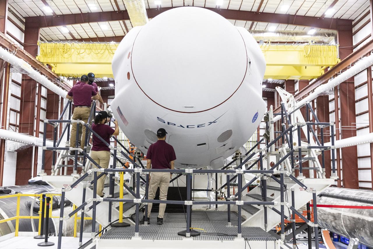 The astronauts for NASA’s SpaceX Crew-1 mission visit the Crew Dragon spacecraft, named Resilience by the crew, inside the SpaceX hangar at Launch Complex 39A on Nov. 8, 2020. NASA astronauts Michael Hopkins, Victor Glover, and Shannon Walker, along with Soichi Noguchi of the Japan Aerospace Exploration Agency (JAXA), will launch on SpaceX’s Falcon 9 rocket and Crew Dragon on the first crew rotation mission to the International Space Station as part of NASA’s Commercial Crew Program.