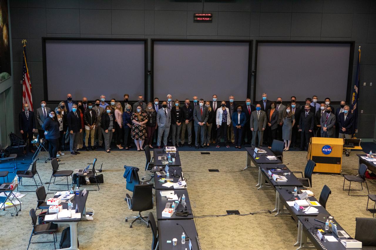 NASA and SpaceX leadership gather for a group photo on the second and final day of the Flight Readiness Review (FRR) for the agency’s SpaceX Crew-1 mission at NASA’s Kennedy Space Center in Florida on Nov. 10, 2020. The FRR focuses on the preparedness of SpaceX’s crew transportation system, the International Space Station, and its international partners to support the flight, and the certification of flight readiness. Crew-1 is the first regular crew mission of a U.S. commercial spacecraft with astronauts to the International Space Station as part of NASA’s Commercial Crew Program. The Crew Dragon Resilience capsule will launch atop a Falcon 9 rocket from Launch Complex 39A carrying NASA astronauts Michael Hopkins, Victor Glover, Shannon Walker and Japan Aerospace Exploration Agency (JAXA) astronaut Soichi Noguchi to the space station for a six-month science mission.